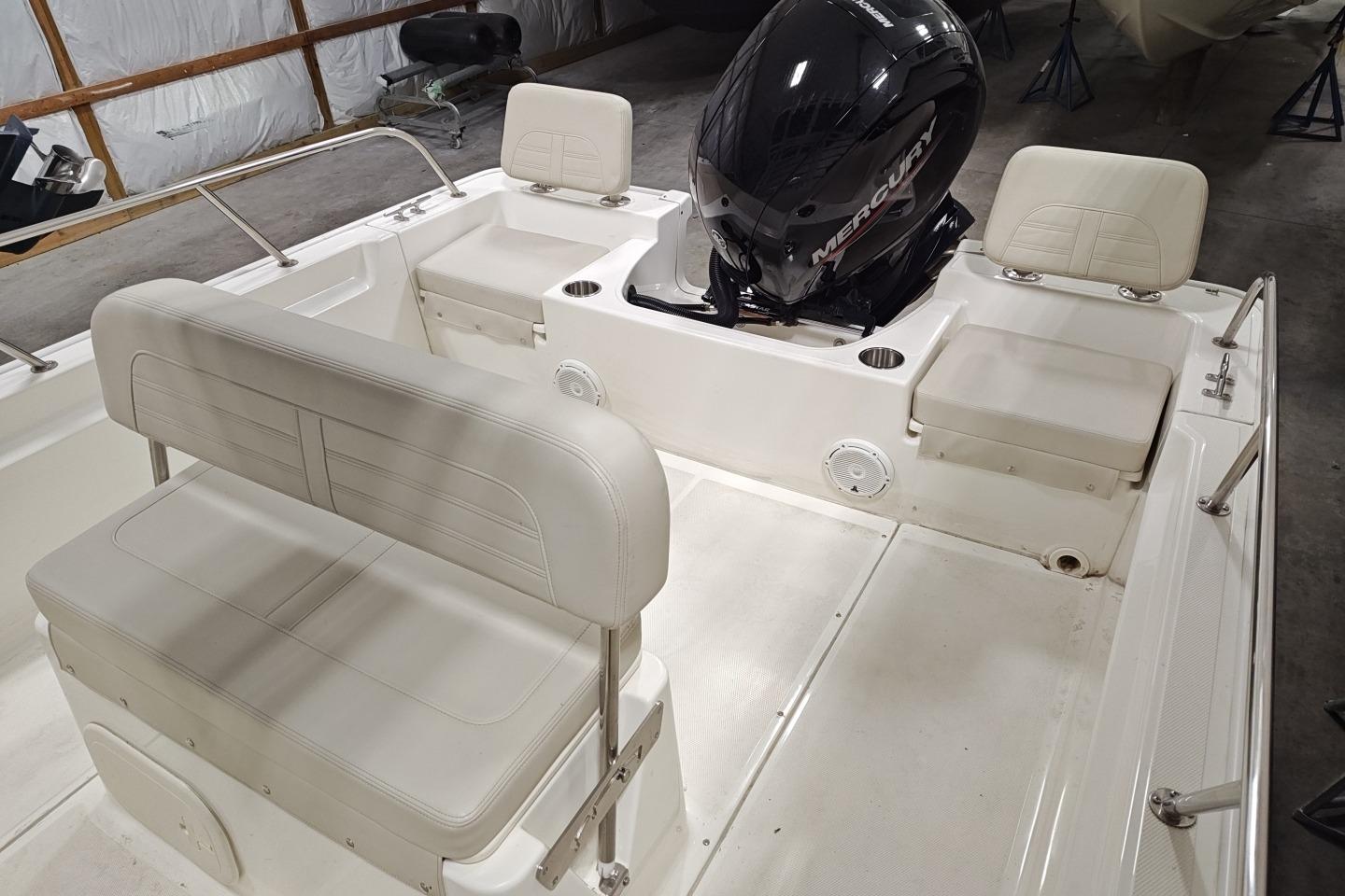 2025 Boston Whaler 190 Montauk boat interior with seating and Mercury engine.
