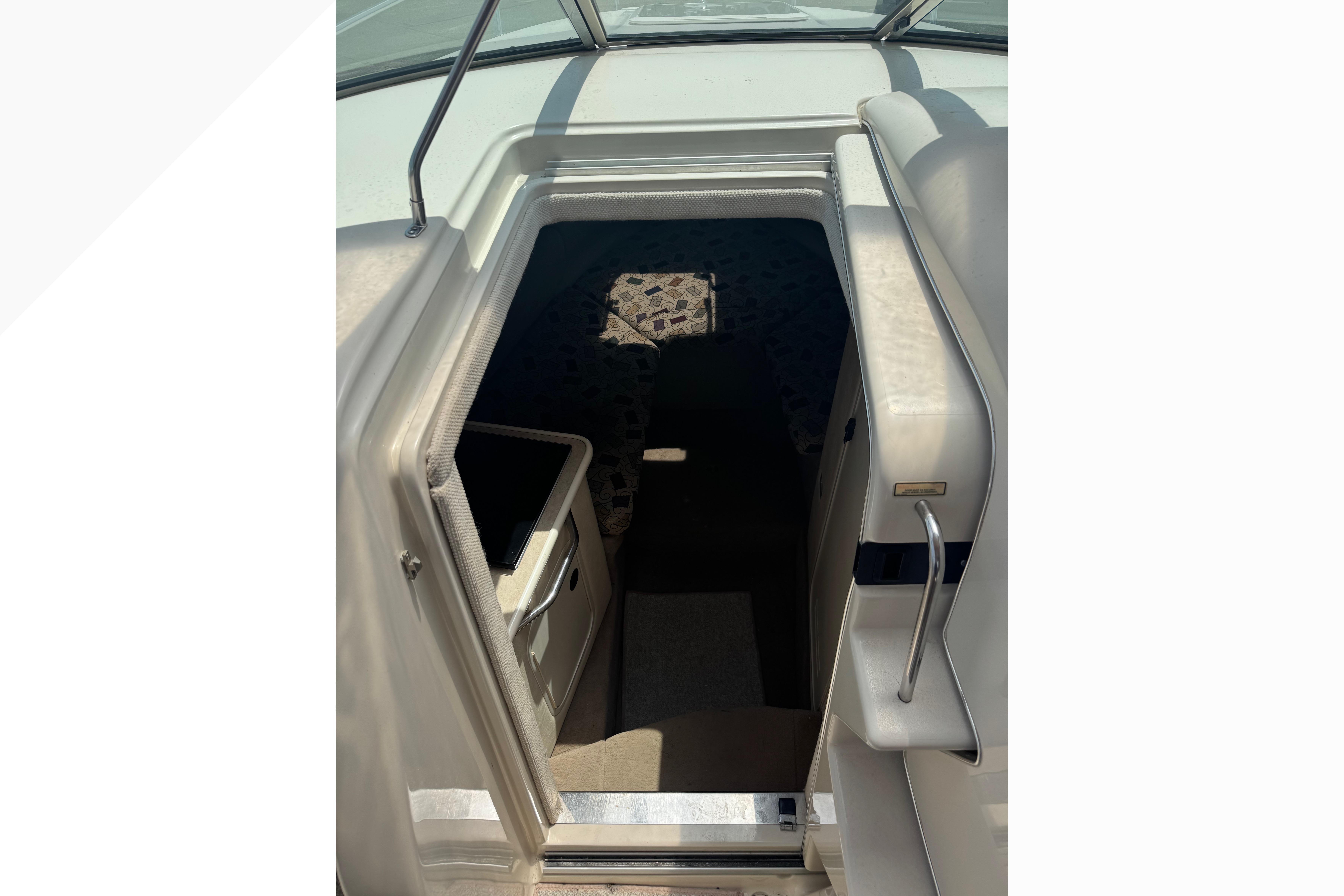 2001 Sea Ray 245 Weekender cabin entrance with interior view.