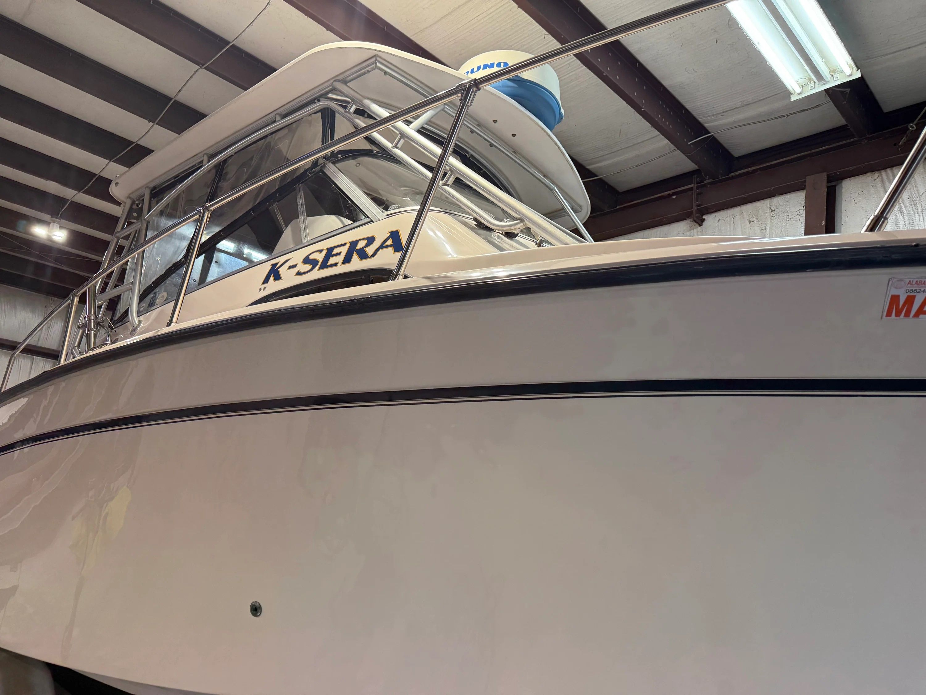 2002 Grady-White Marlin 300 boat in a warehouse.