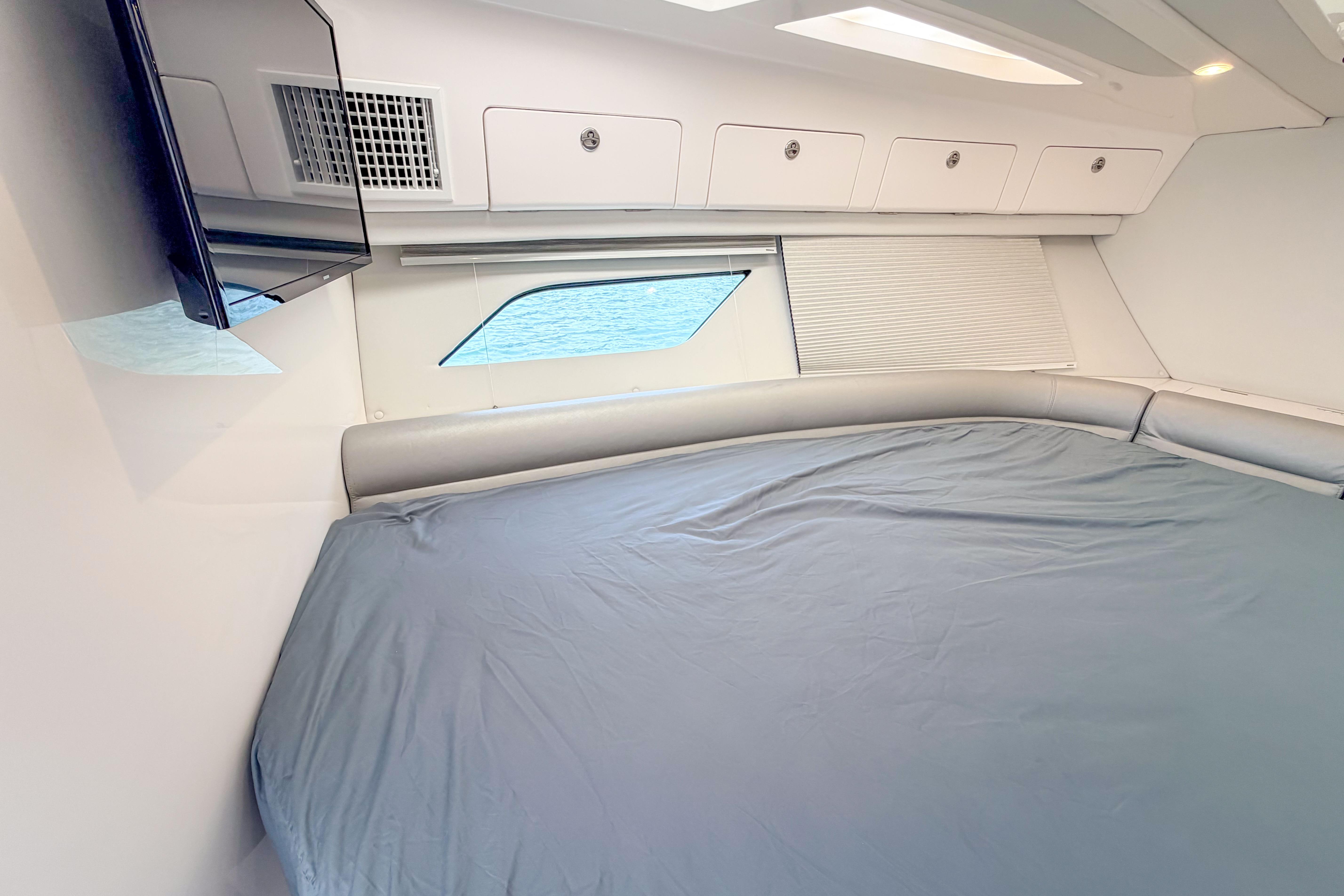 Luxurious cabin interior of 2021 Intrepid 409 Valor yacht with modern amenities.