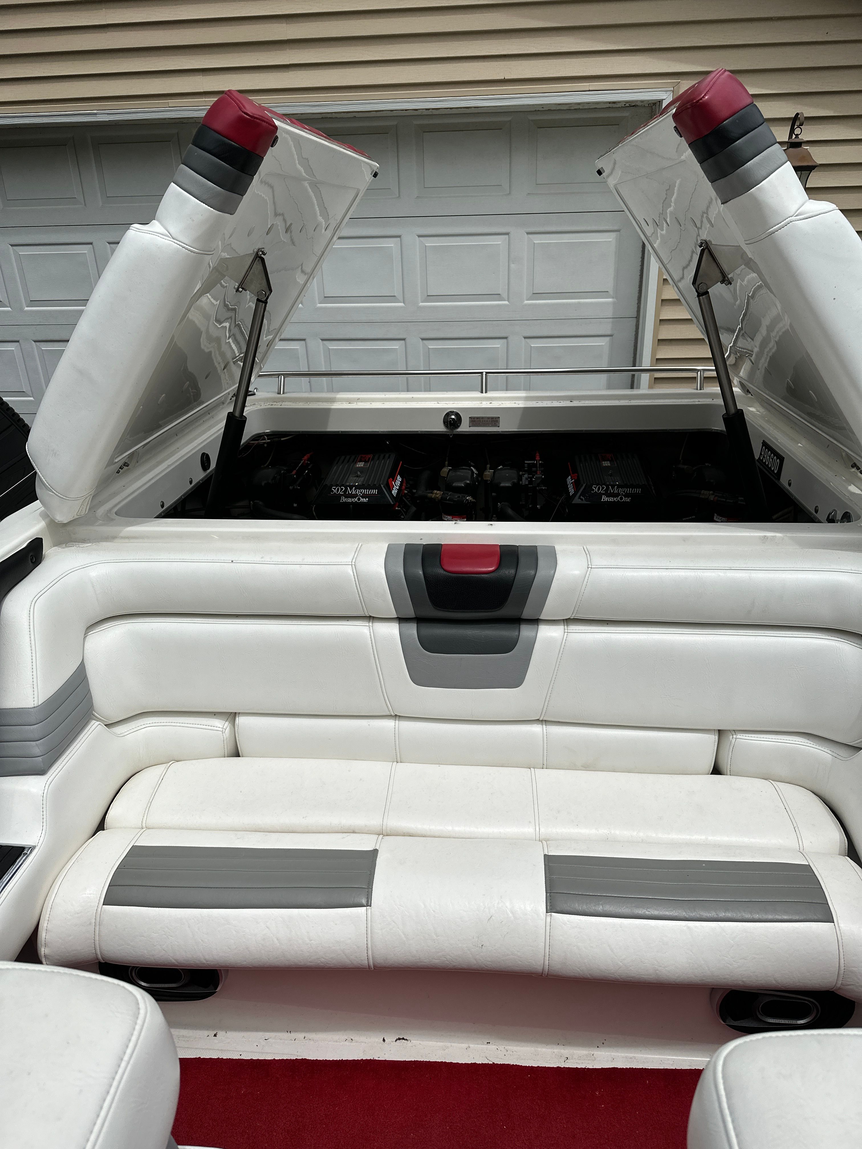 The image shows the cockpit of a 1994 Fountain EXECUTIONER with white and gray seating.