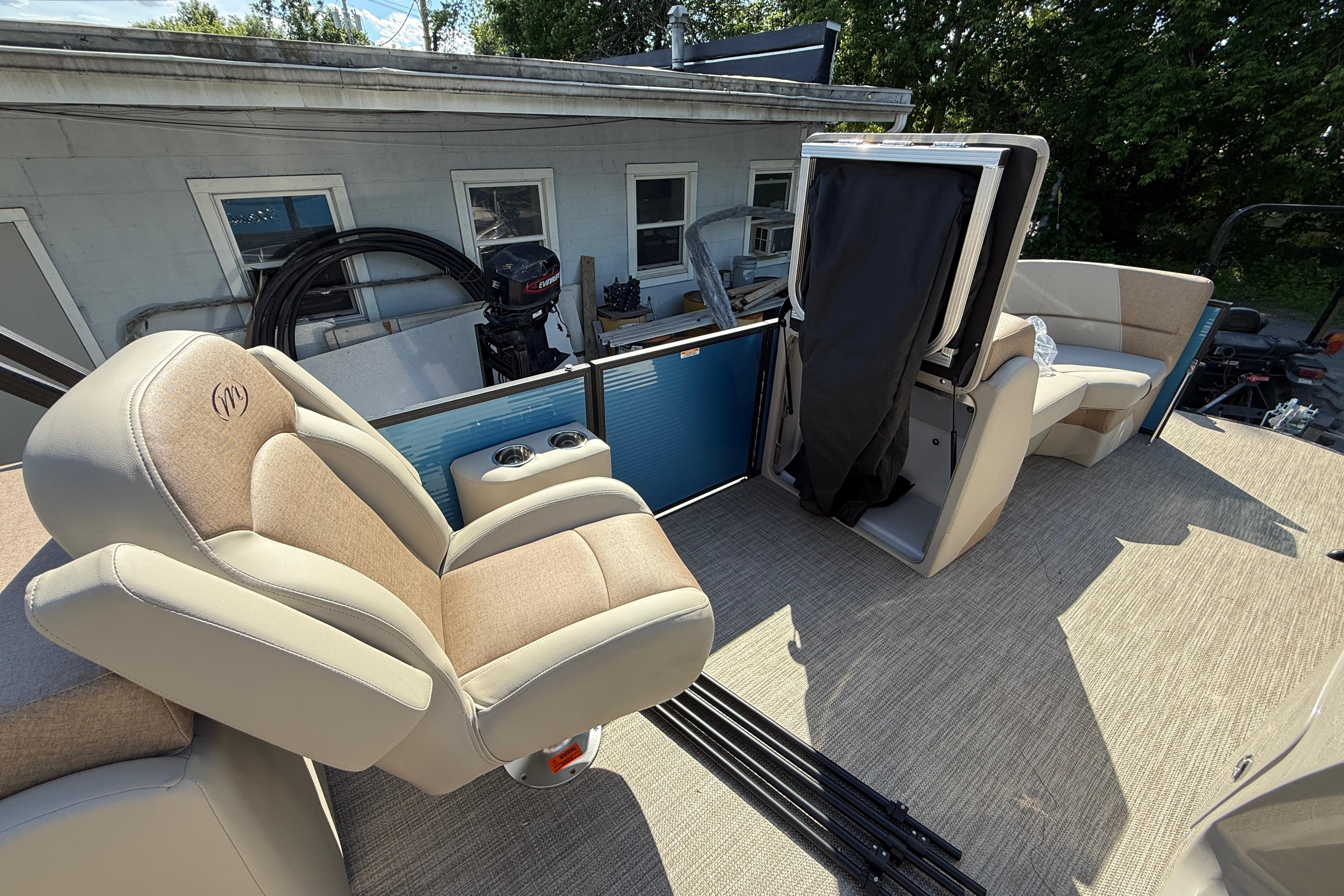 2027 Manitou Aurora RF 23 pontoon boat interior with plush seating and modern design.