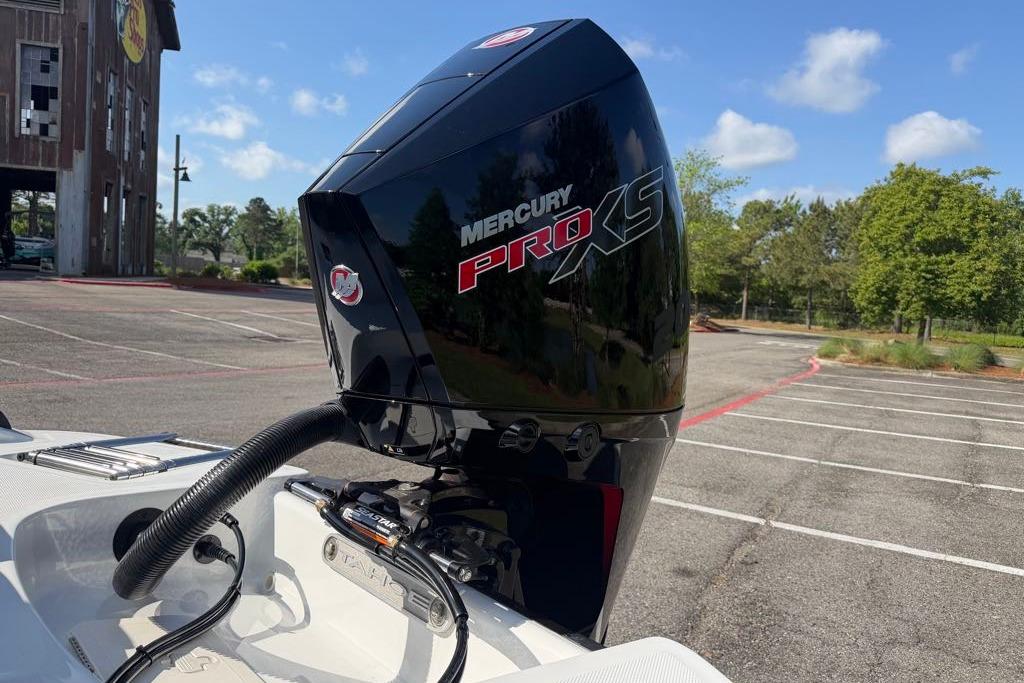 Mercury Pro XS engine on 2026 Tahoe T21 boat in parking lot.