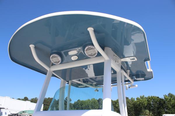 2023 Sea Pro 239 Center Console boat with blue T-top and speakers.