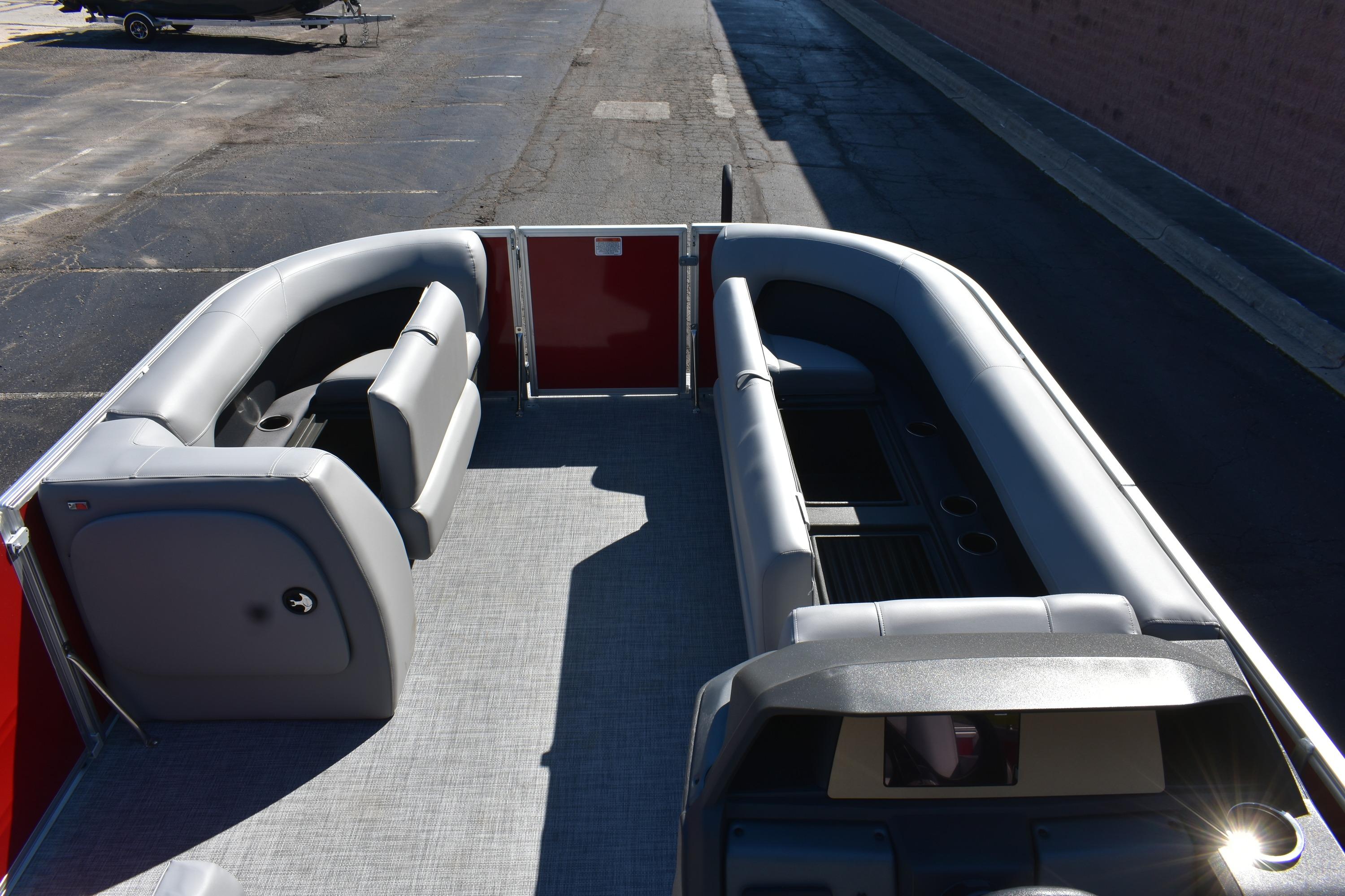 2026 Sun Tracker Party Barge 18 DLX interior with gray seating and spacious layout.