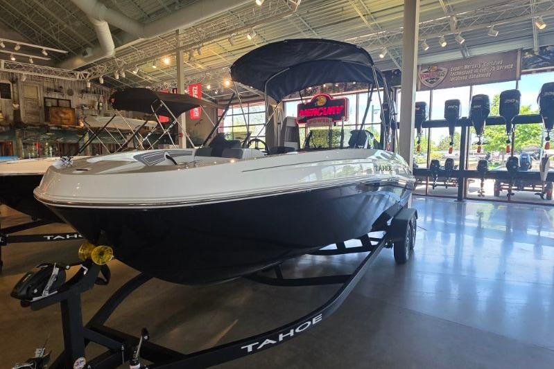 2026 Tahoe T21 boat displayed in a showroom with modern interior and lighting.