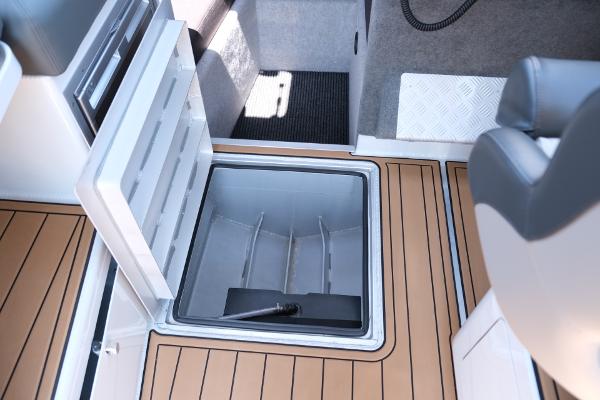 Makaira Gen3 800 boat interior with open storage compartment, 2023 model.