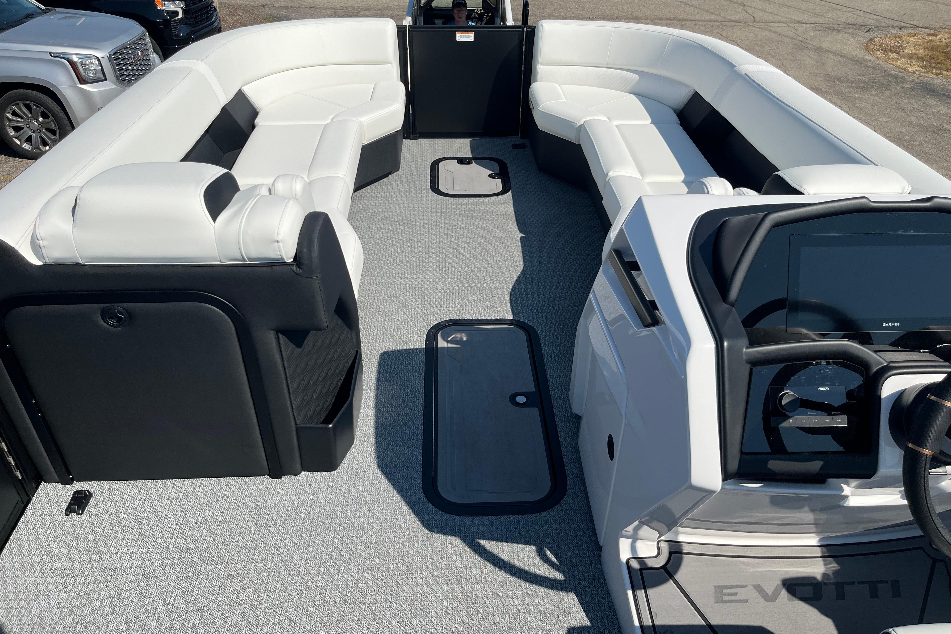 Luxurious 2026 Evotti 725CS boat interior with plush seating and modern dashboard.