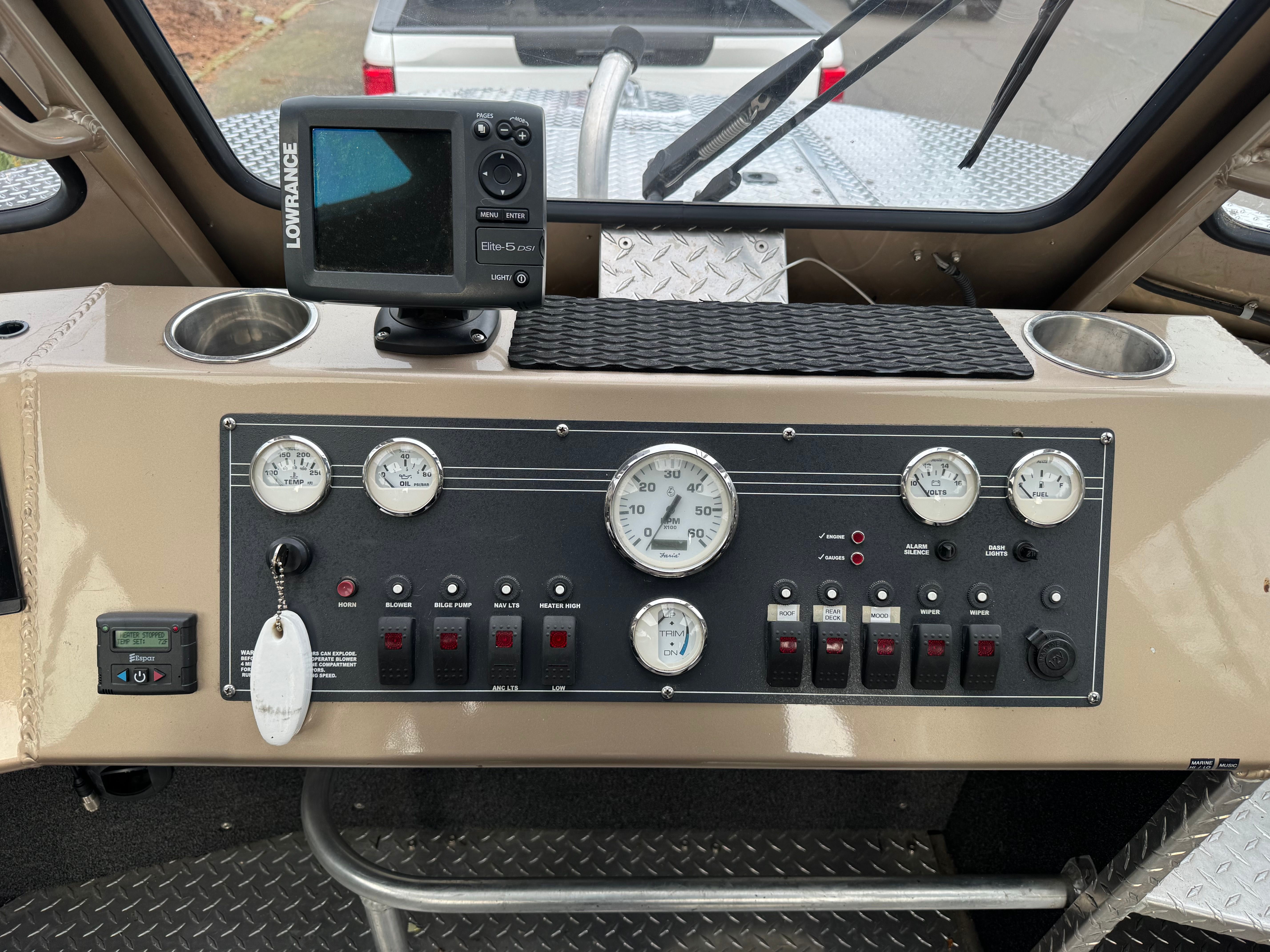 Dashboard of a Custom RMX 24 boat with Lowrance GPS.