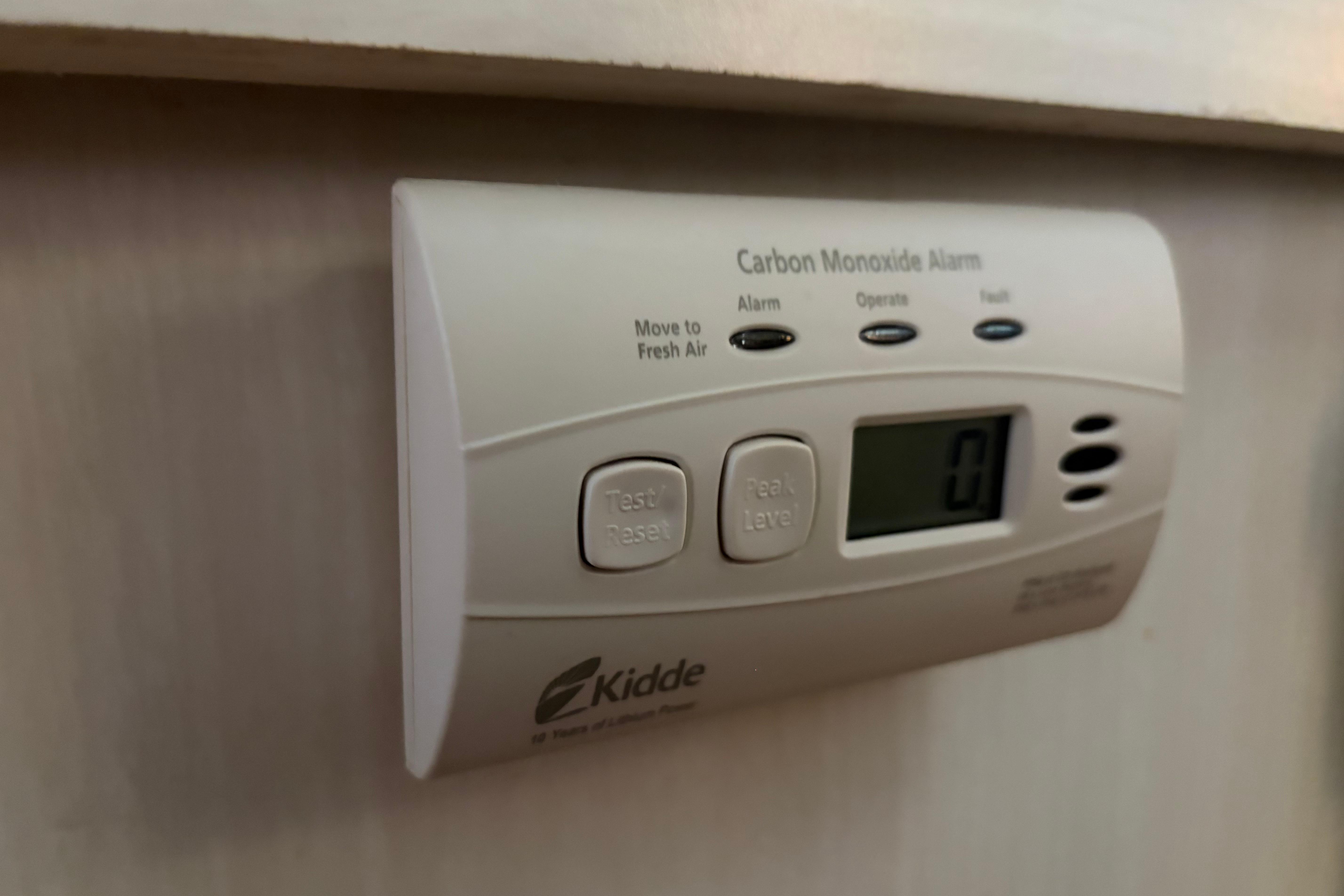 Carbon monoxide alarm on 1971 Chris-Craft 42 Commander boat interior wall.