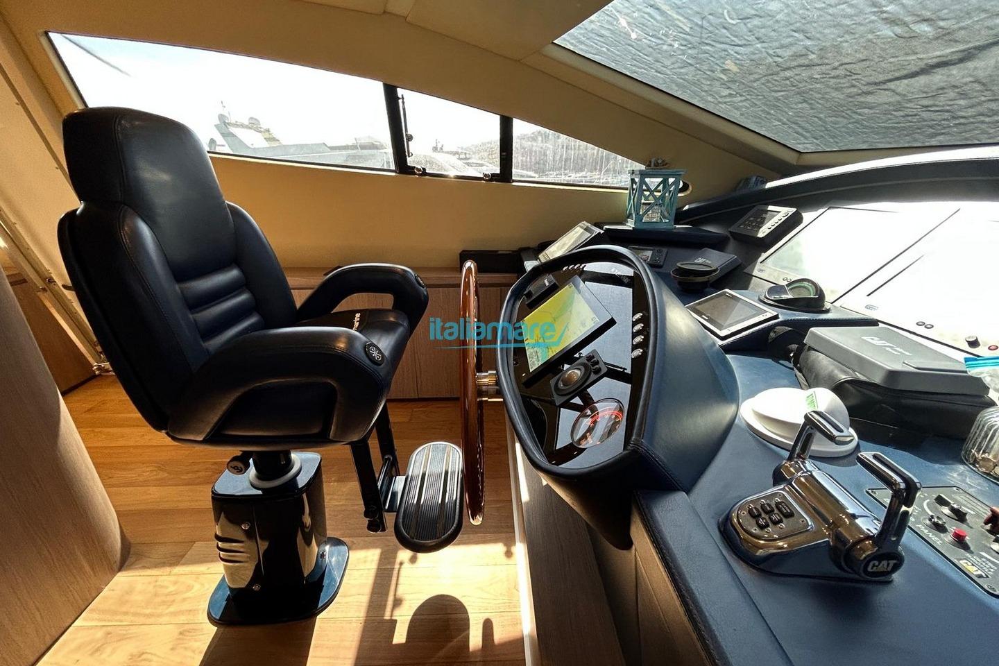 Captain's chair and control panel of 2009 PerMare Amer 92 yacht cockpit.