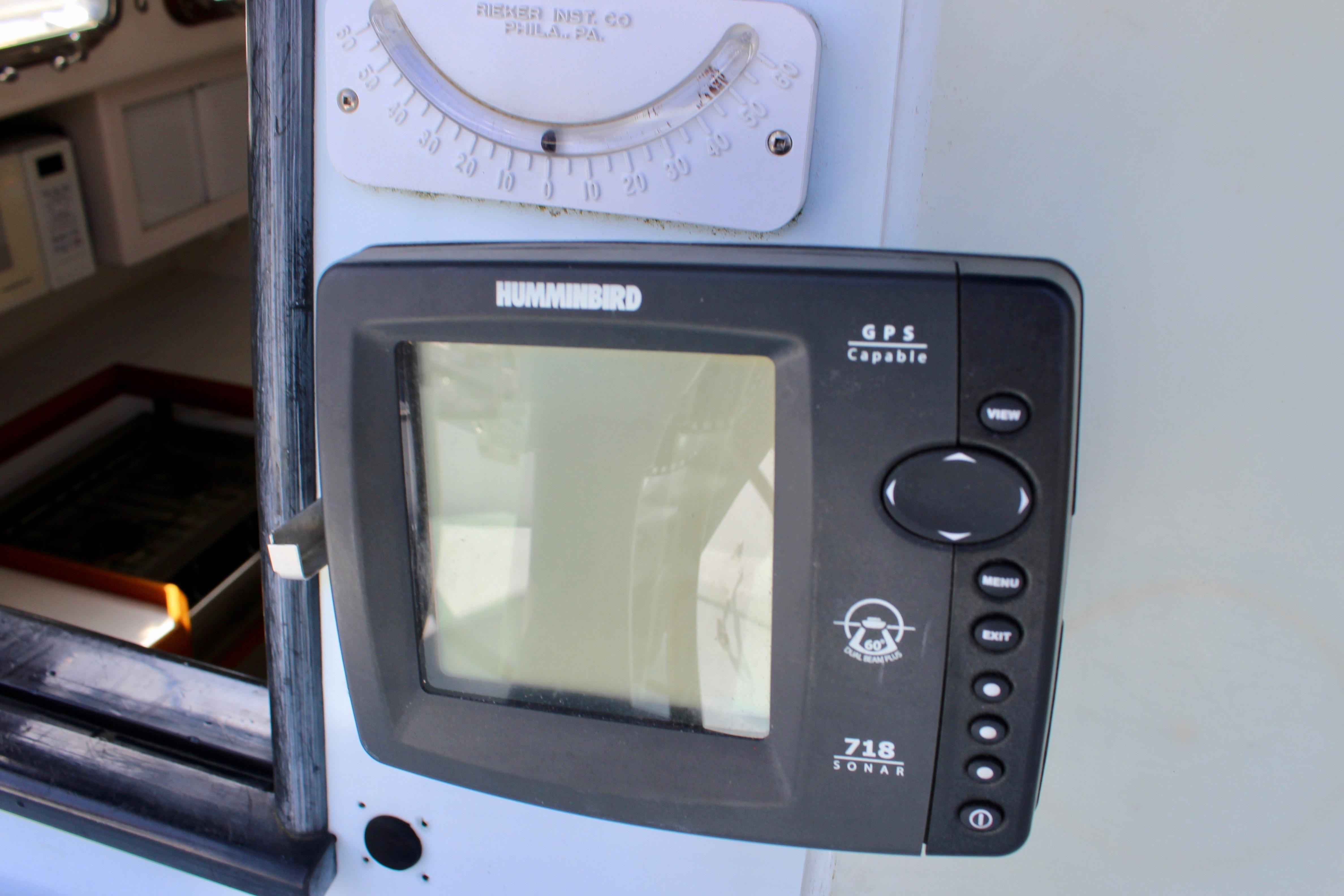 Humminbird GPS sonar device on 1993 Freya 39 boat dashboard.