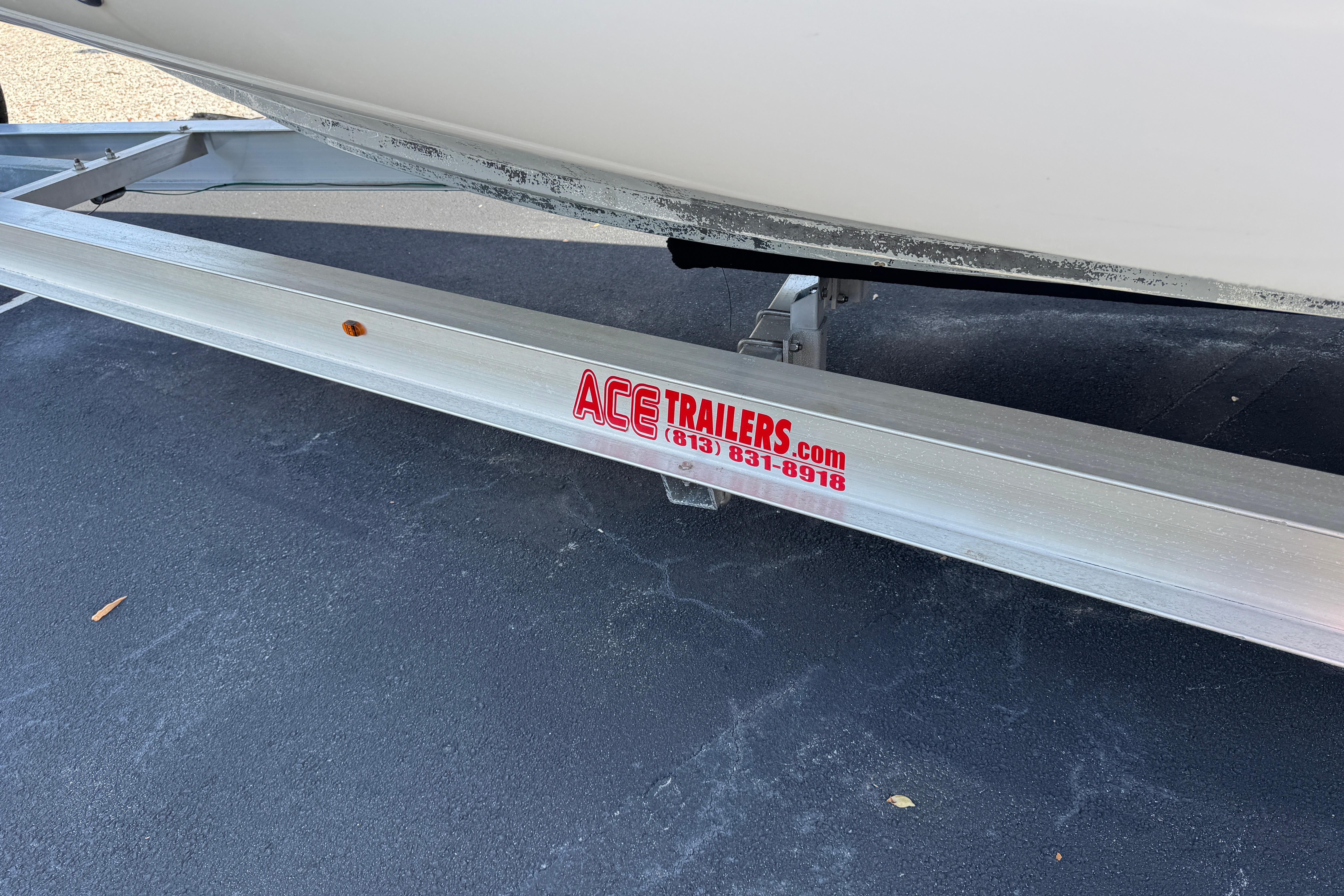 Trailer for 2018 Hurricane SunDeck 2400 OB boat by Ace Trailers.