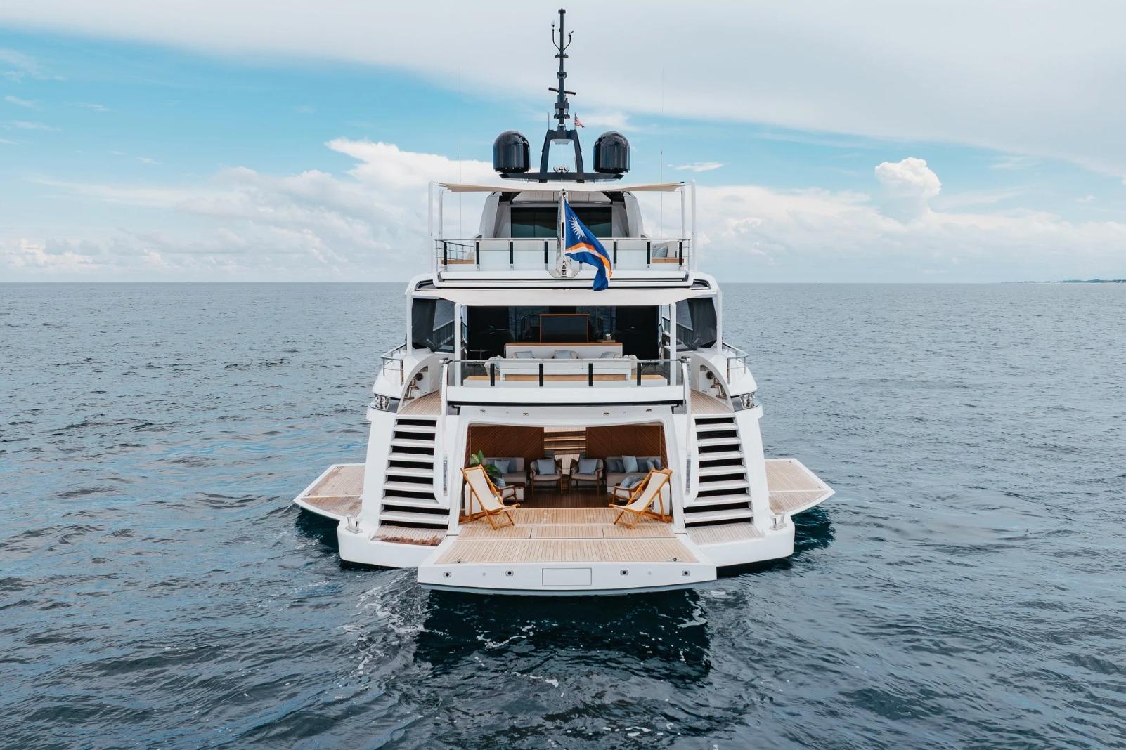 Luxury Overmarine Gransport 54 yacht on open sea, 2020 model, rear view.