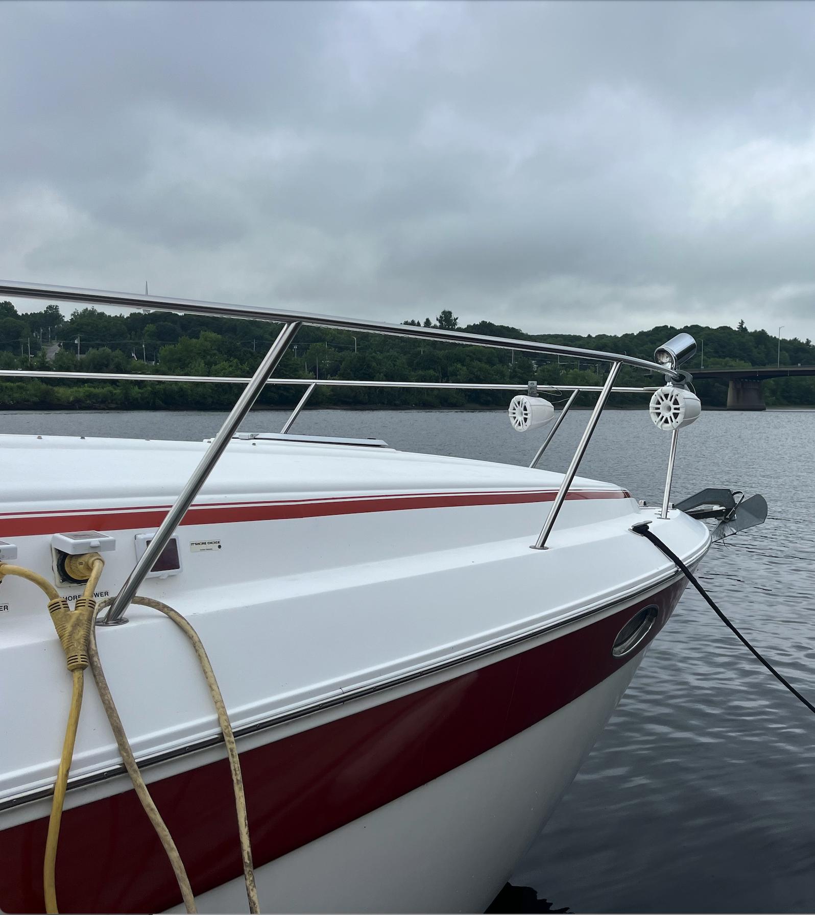 2006 Rinker 390 Express Cruiser docked on a cloudy day.