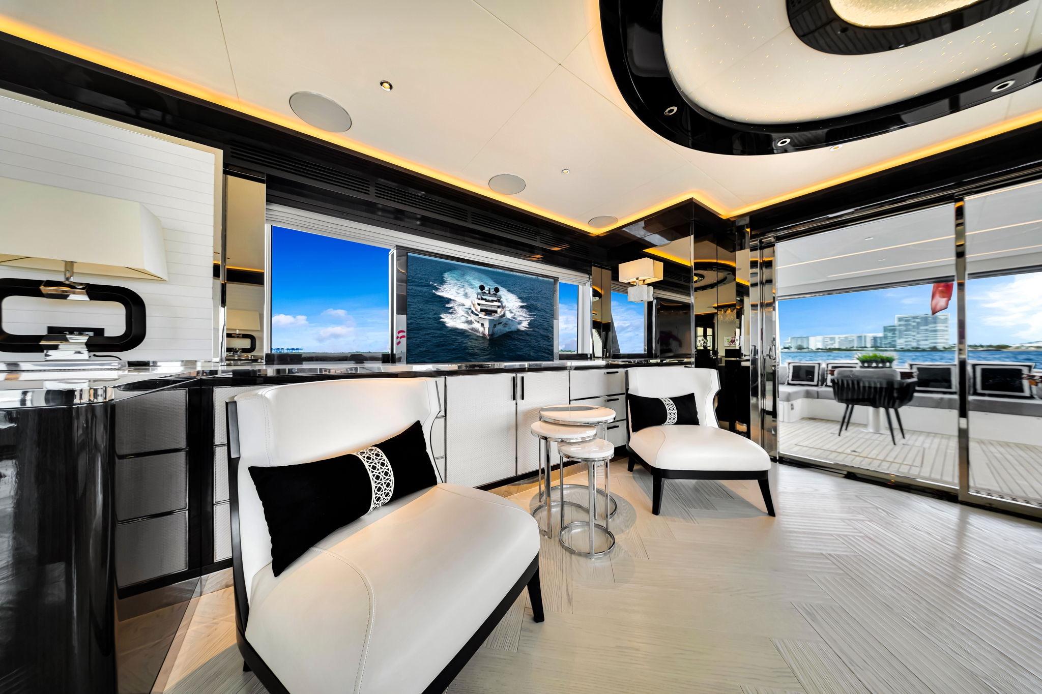 Luxurious interior of 2021 Sirena 88 yacht with modern furnishings and ocean view.