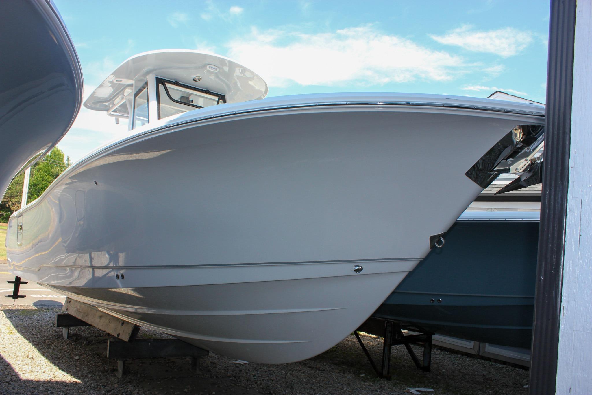 2027 Sea Hunt Ultra 275 SE boat displayed outdoors under clear sky.