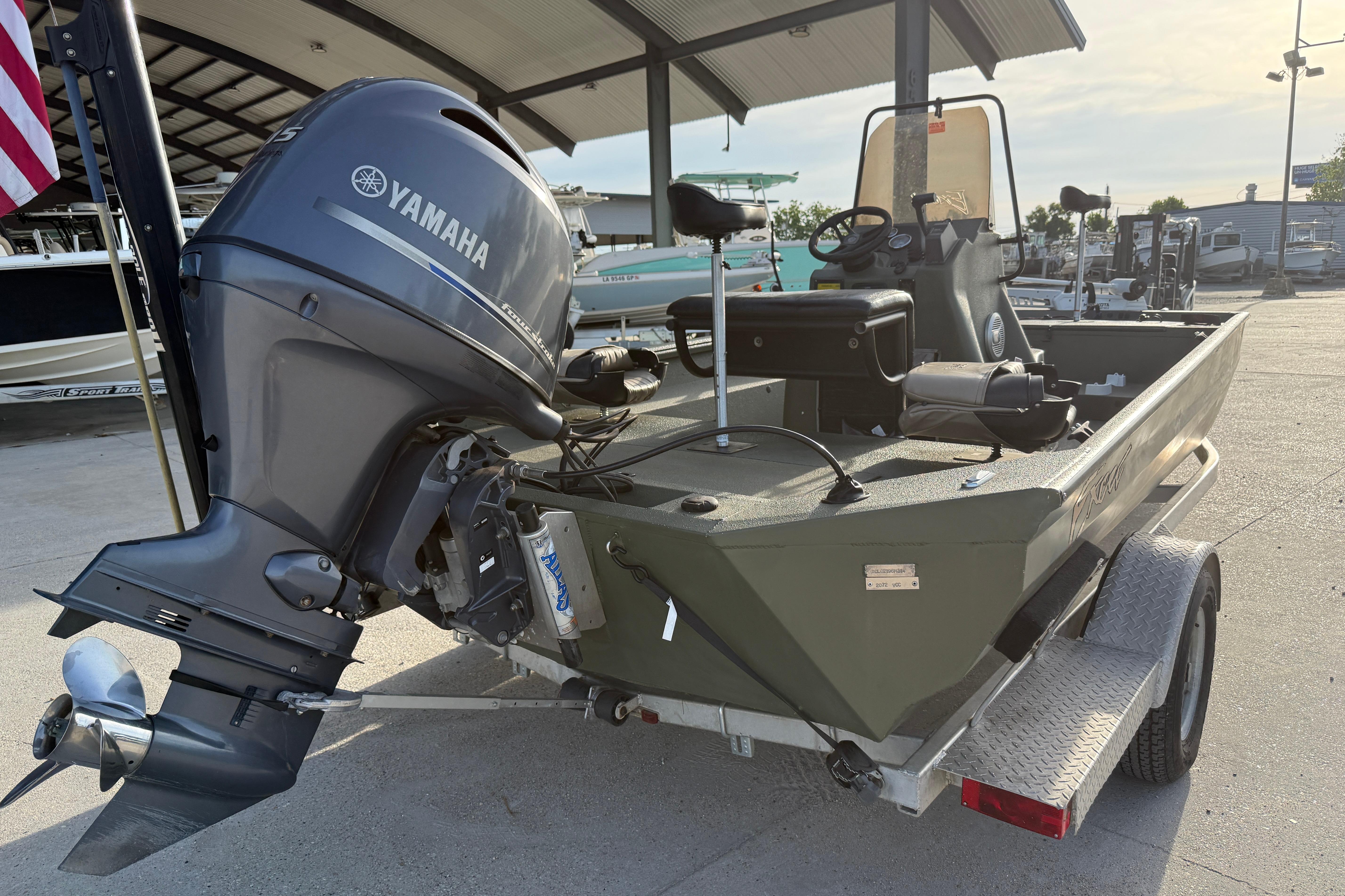 2014 Excel 203 Bay Pro boat with Yamaha outboard motor on trailer.
