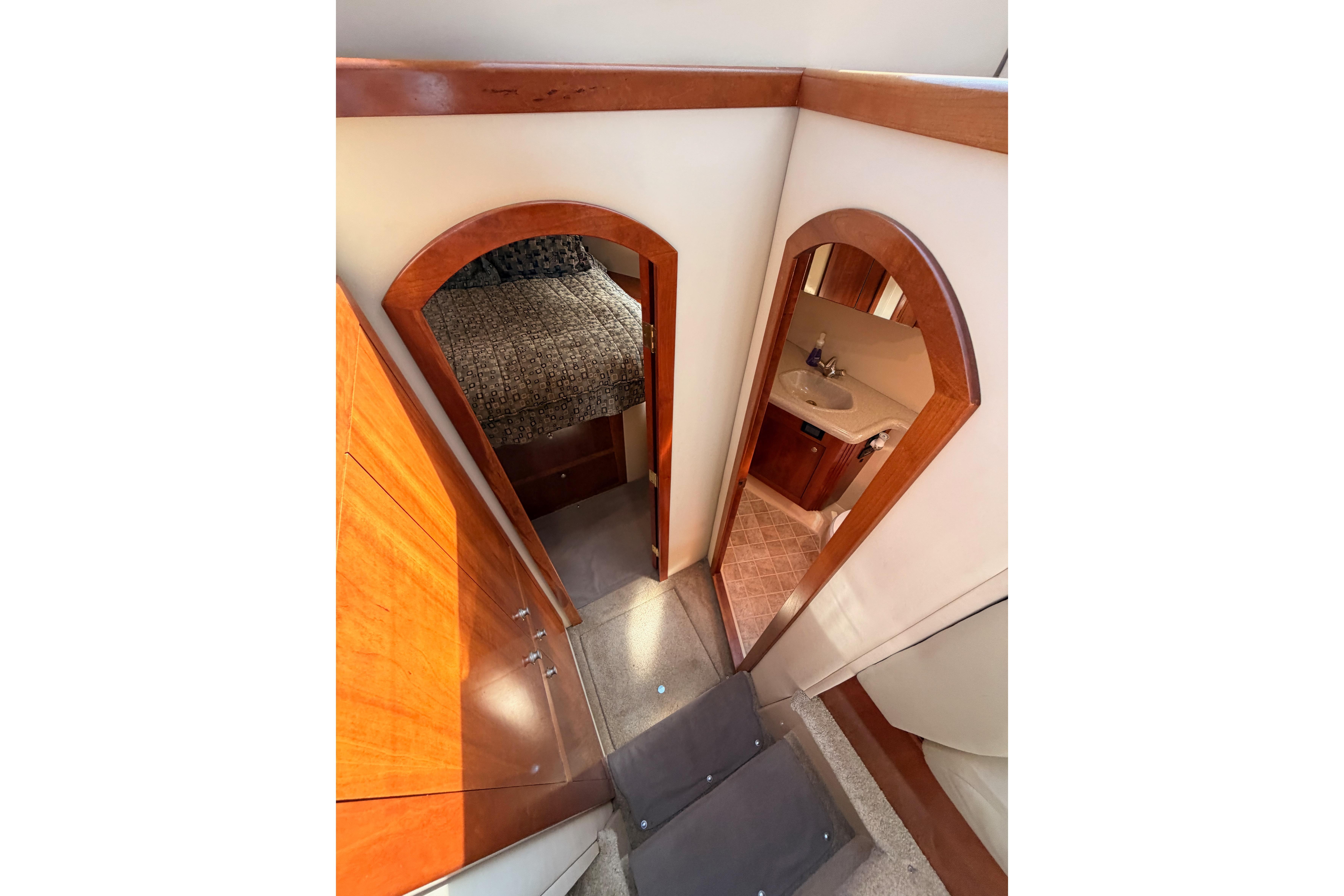 Interior view of 2005 Cruisers Yachts 405 Express Motoryacht, featuring bedroom and bathroom.