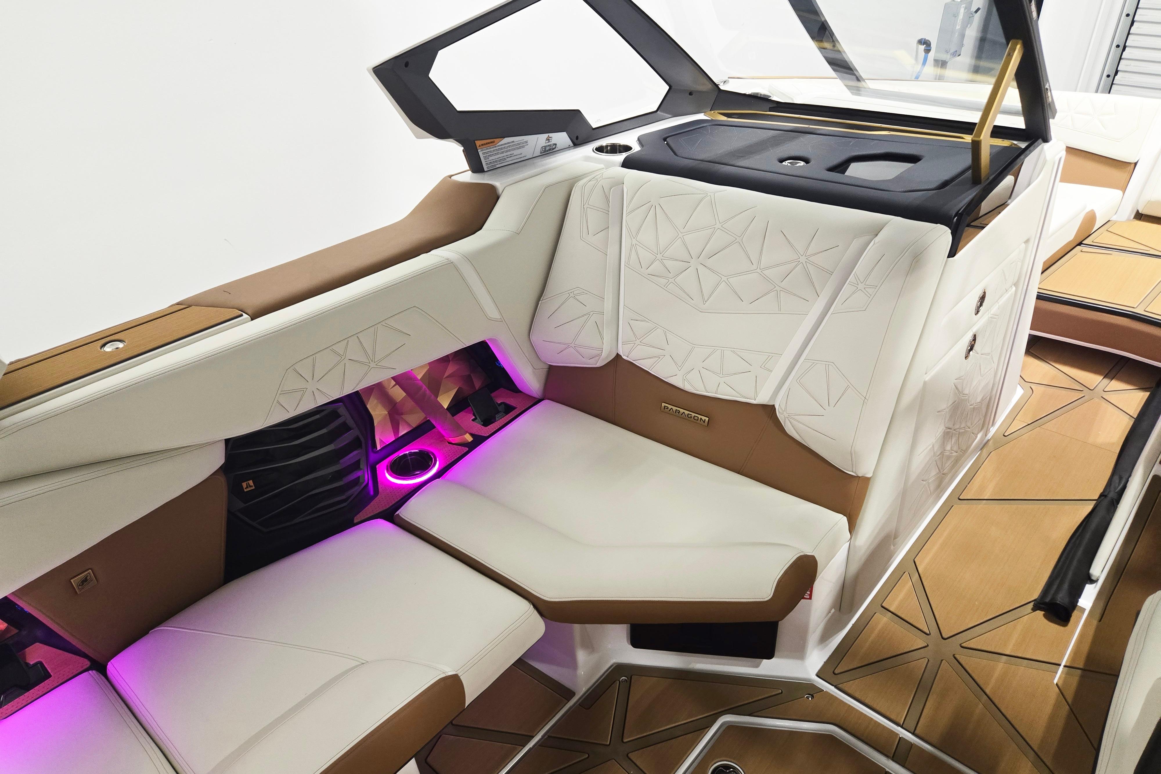 Luxurious interior of 2026 Nautique Super Air Nautique G23 Paragon with ambient lighting.
