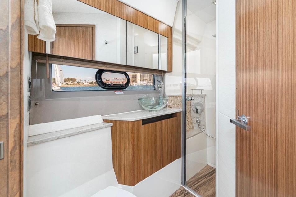 Luxurious bathroom interior of 2017 Sea Ray 460 Sundancer yacht with modern fixtures.