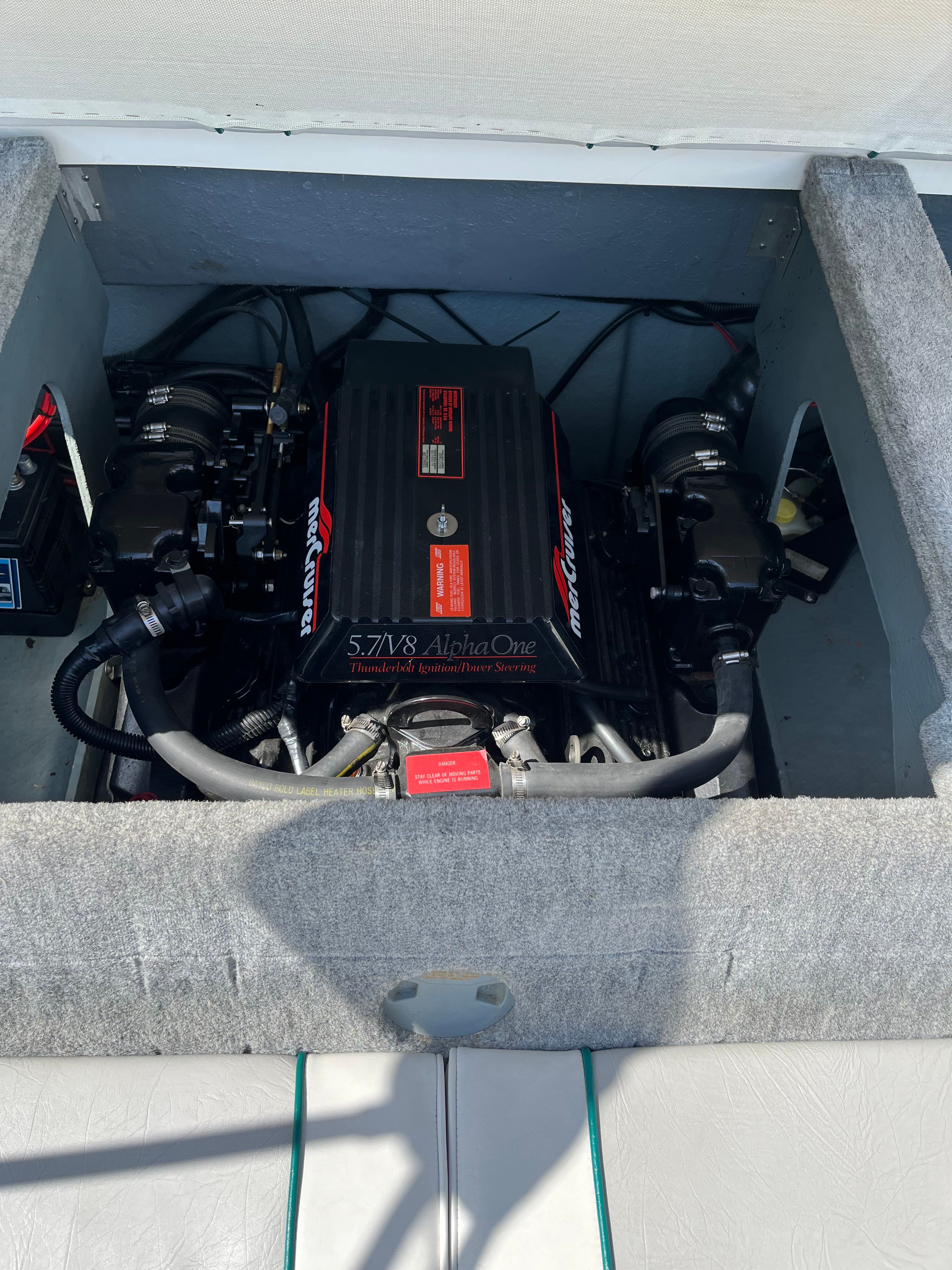 An open boat engine compartment with a MerCruiser engine.