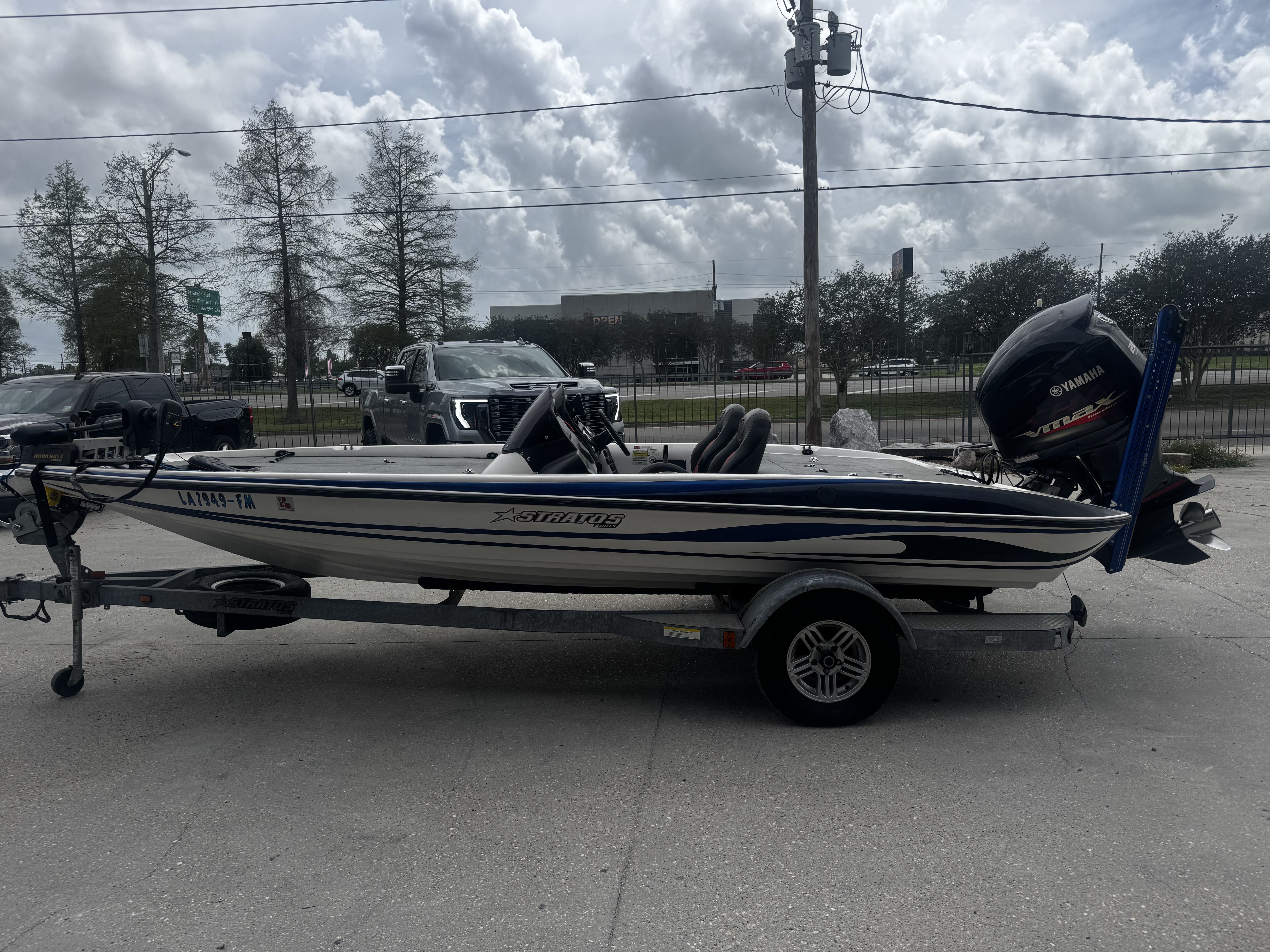 2006 Stratos 285 Pro XL boat on trailer, side view.