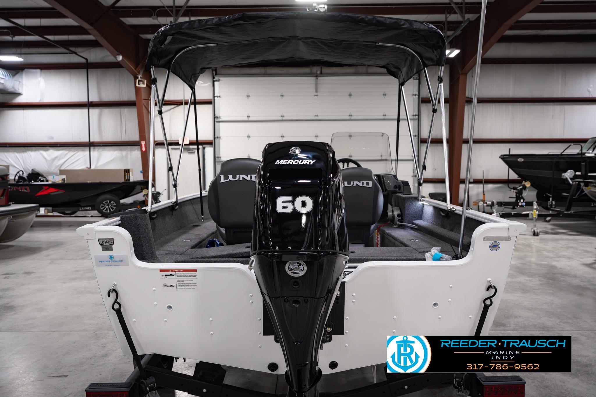 2026 Lund 1650 Rebel XL SS boat with Mercury 60 engine in a showroom.