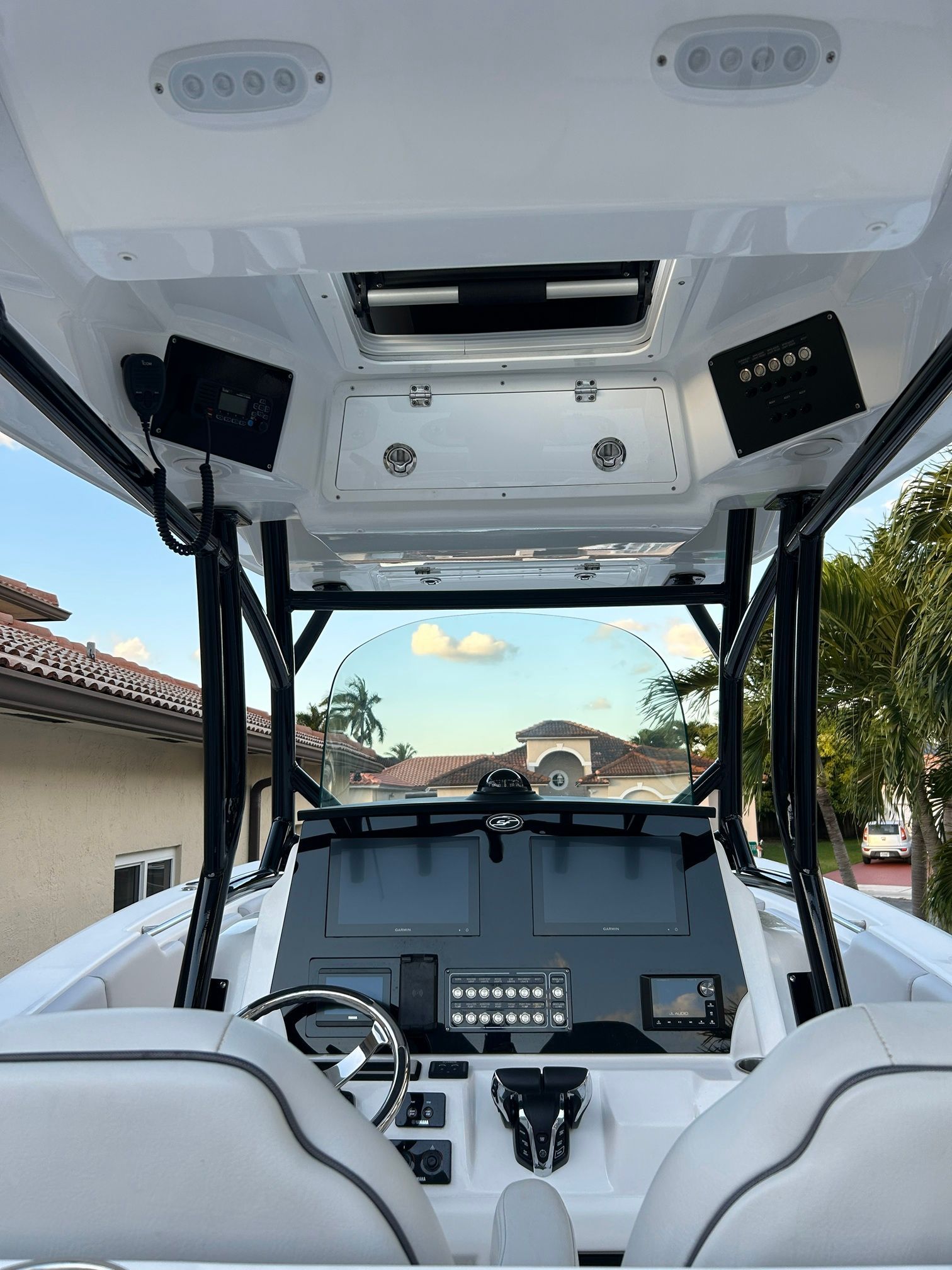 Interior view of a modern boat with helm console and electronics.