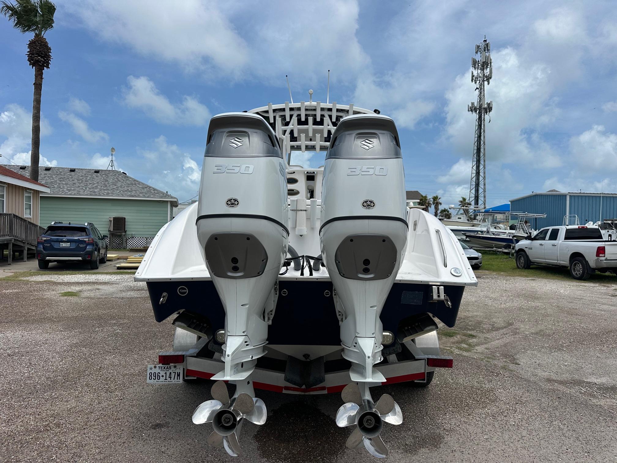 2023 Cape Horn 32xs boat with dual 350 horsepower engines, parked outdoors.