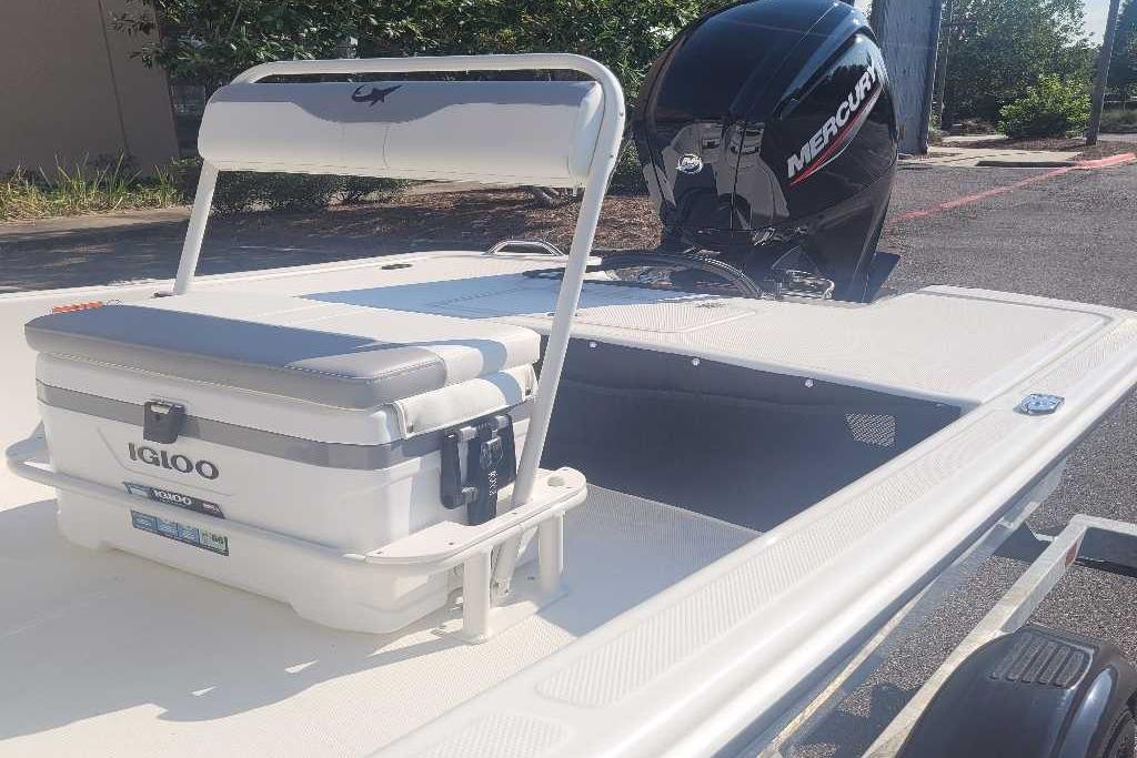 2026 Mako Pro Skiff 17 CC boat with Igloo cooler and Mercury outboard motor.
