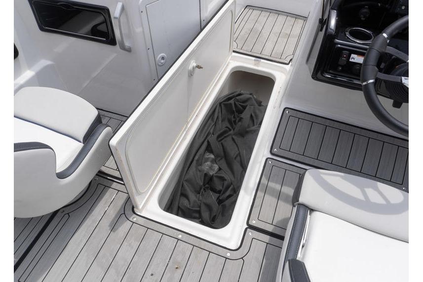 2021 Yamaha Boats 195S interior storage compartment with open hatch and seating.