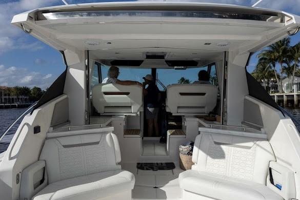 2022 Tiara Sport 43 LE luxury boat interior with white seating and modern design.