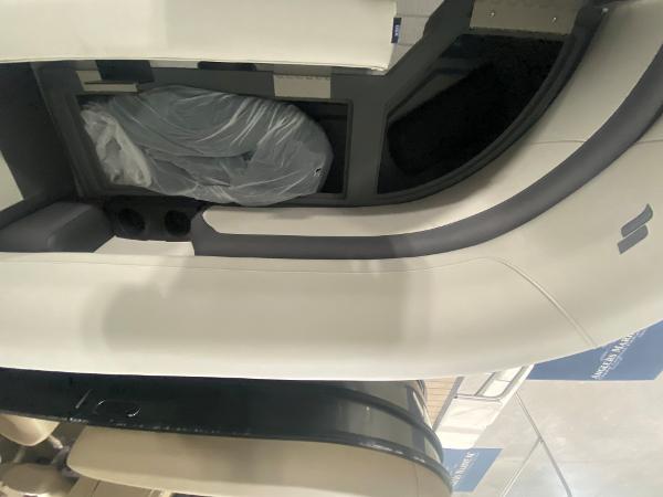 2024 Starcraft EXS 1 boat interior seating with storage compartment.