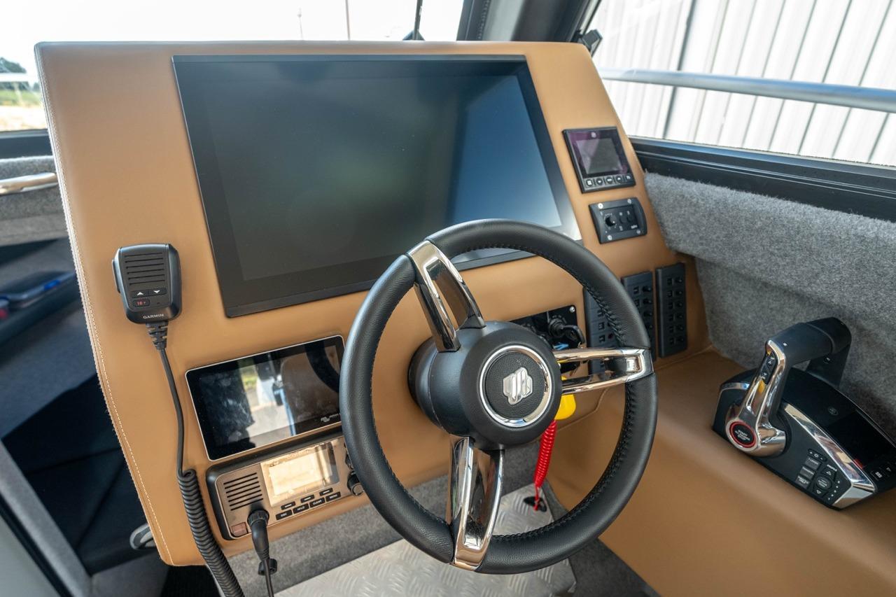 Cockpit of 2025 Makaira Gen 3 36 boat with modern steering and controls.