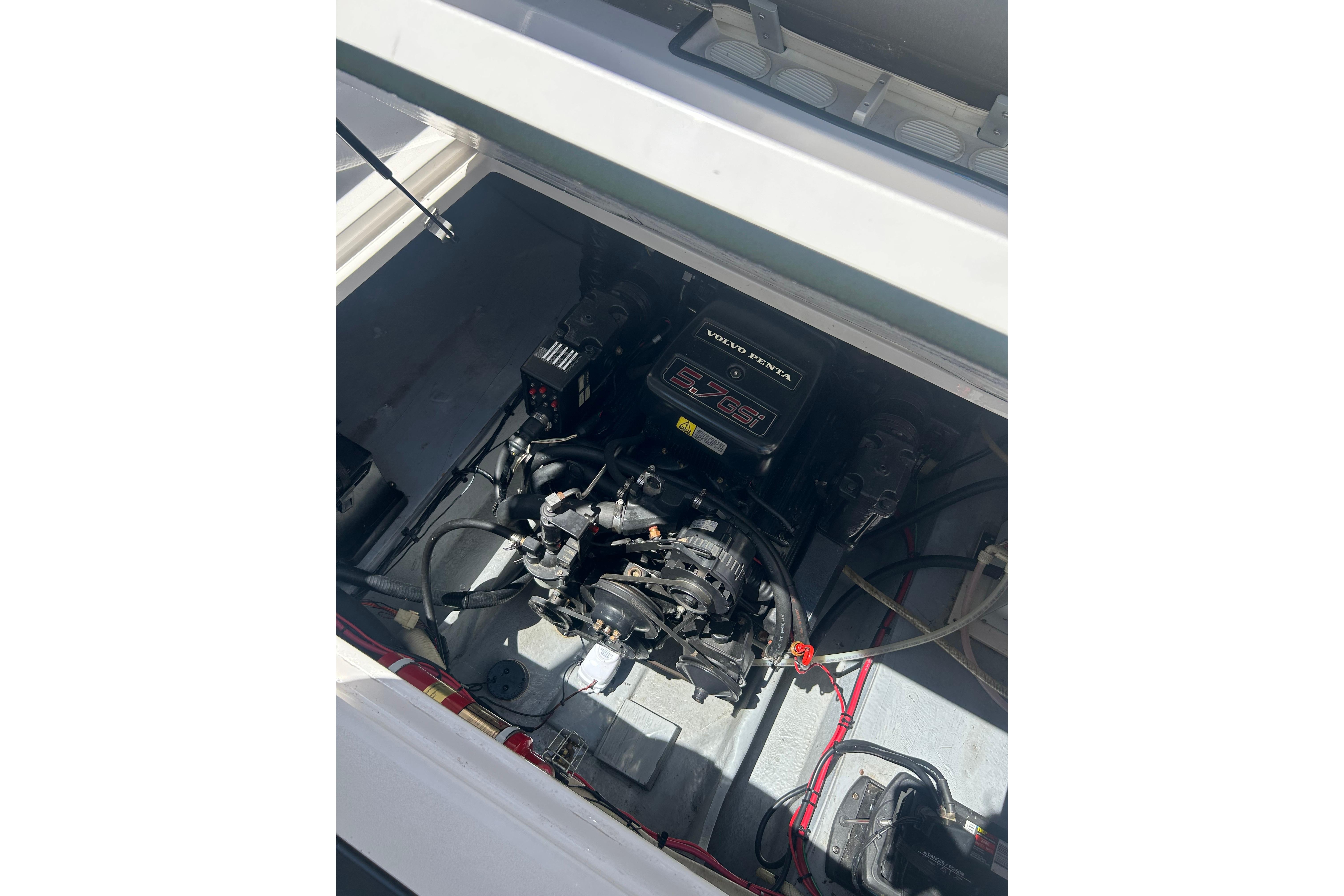 Engine compartment of a 1998 Four Winns 258 Vista boat with Volvo Penta 5.7 GSi engine.
