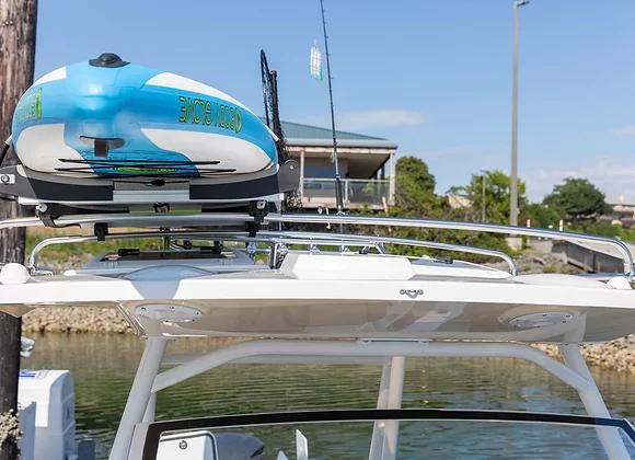 2025 Solara 250 Center Walkaround with kayak on roof rack, docked by the water.