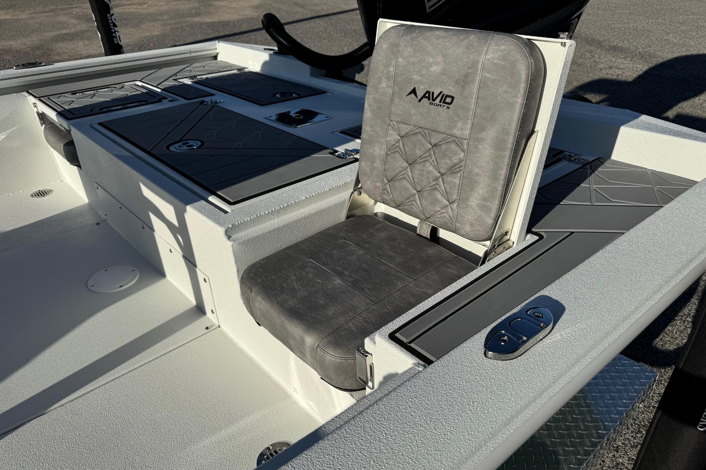 2025 Avid 23 Mag boat seat with gray upholstery and storage compartments.
