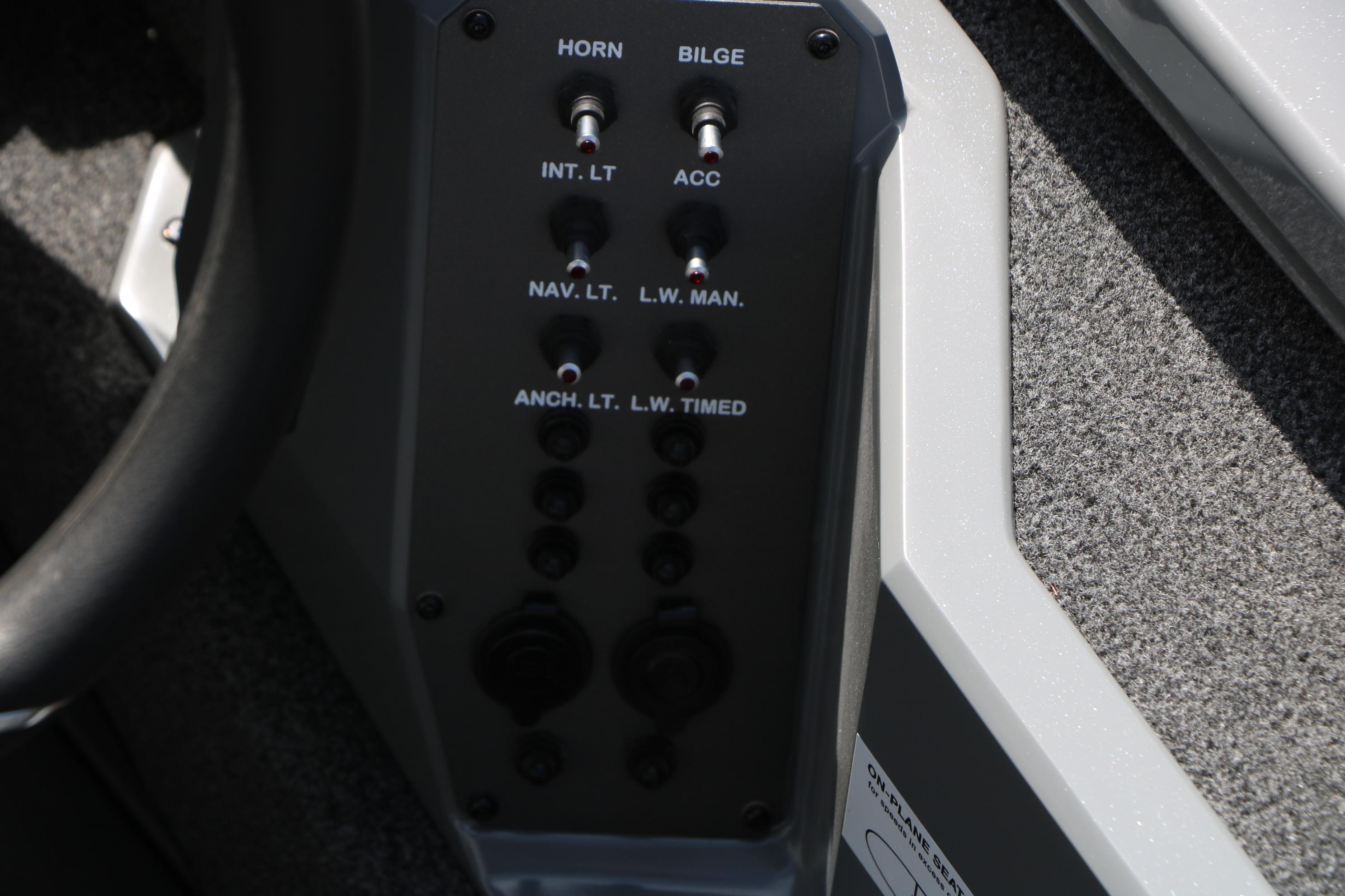 Control panel of 2026 Vexus AVX1980 boat with switches for horn, bilge, and lights.