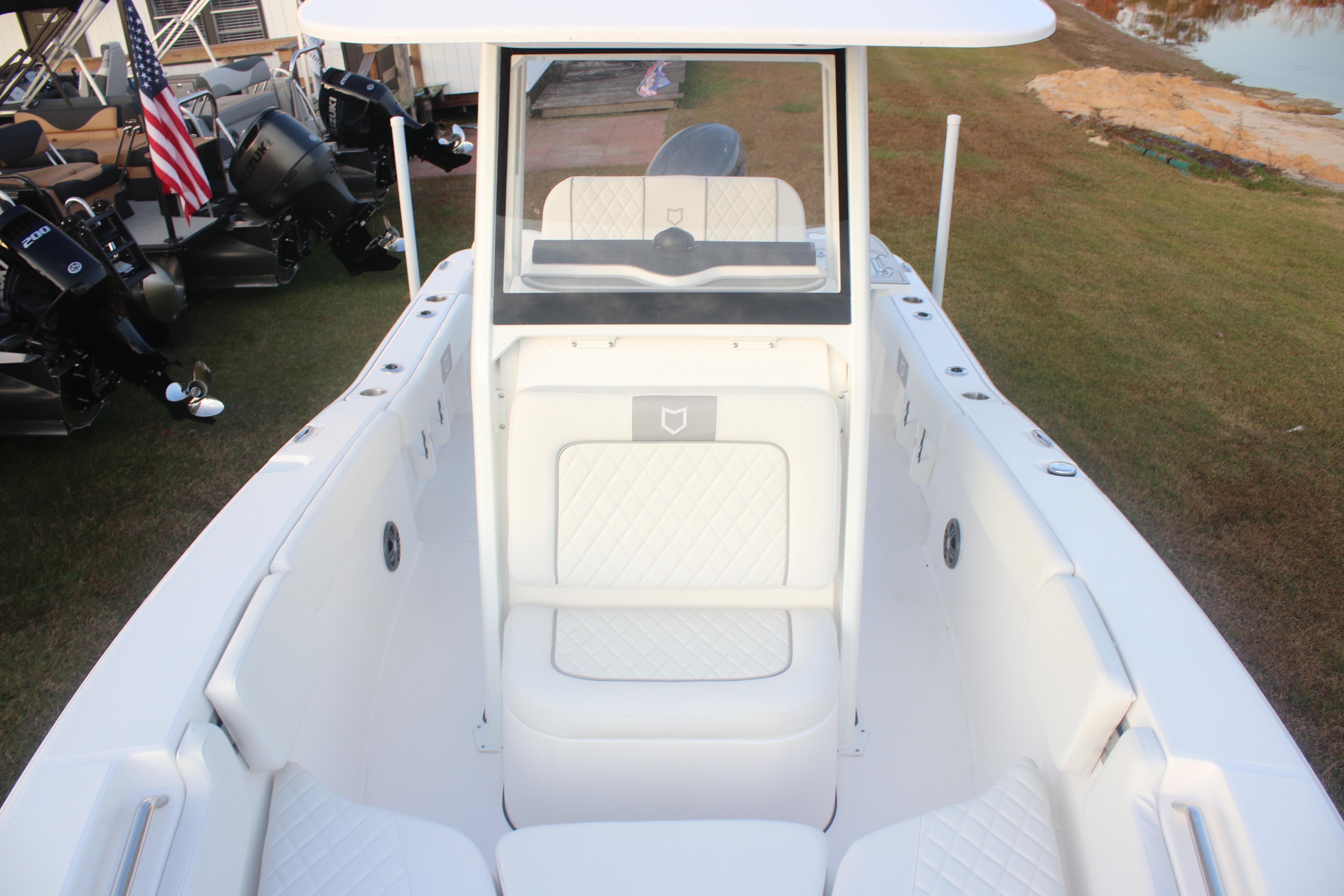 2026 Sea Fox 228 Commander boat interior with white seating and console.