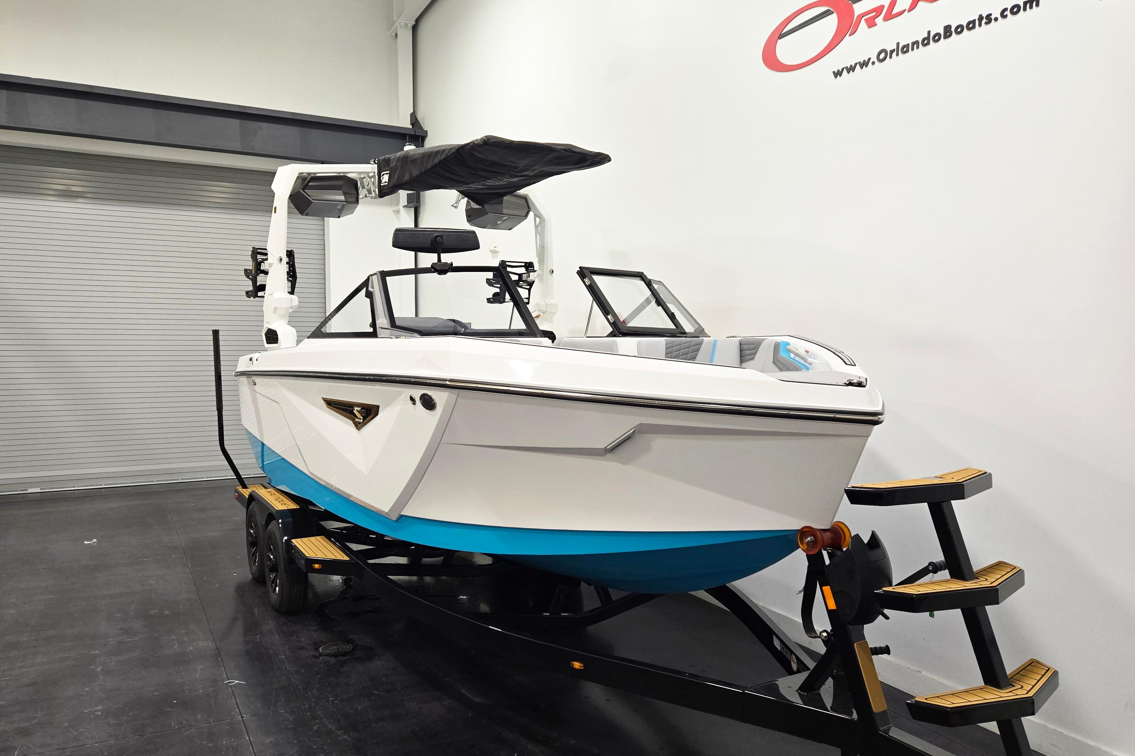 2026 Nautique Super Air Nautique S21 boat on trailer in showroom.