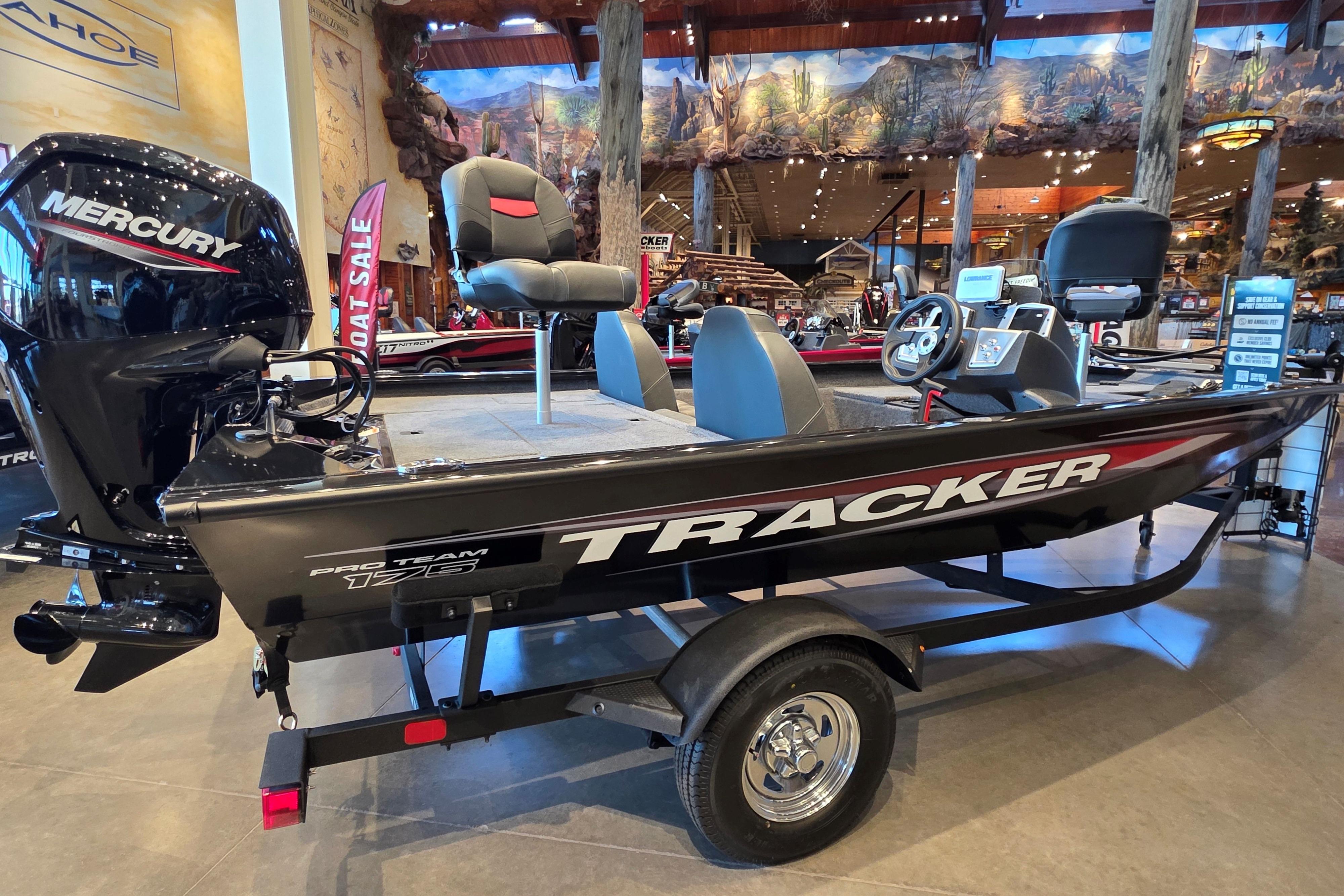 2026 Tracker Pro Team 175 boat displayed indoors with Mercury engine.