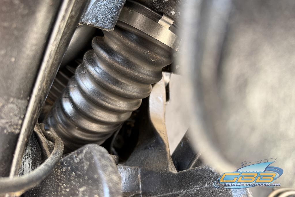 Close-up of a 1999 Sea Ray 290 Sundancer engine component with Georgia Boat Brokers logo.