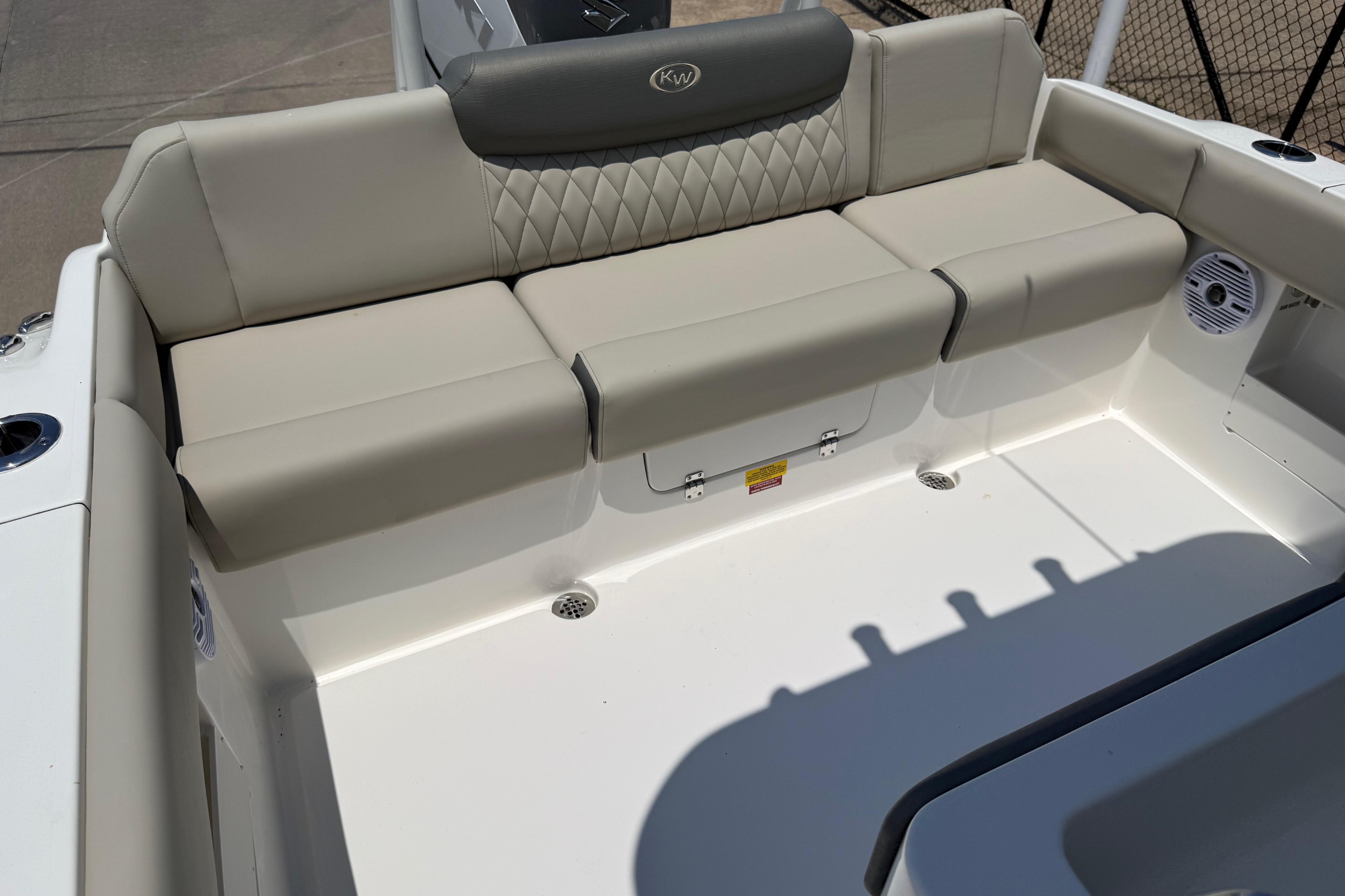 2027 Key West 249 FS boat seating area with beige upholstery and diamond stitching.