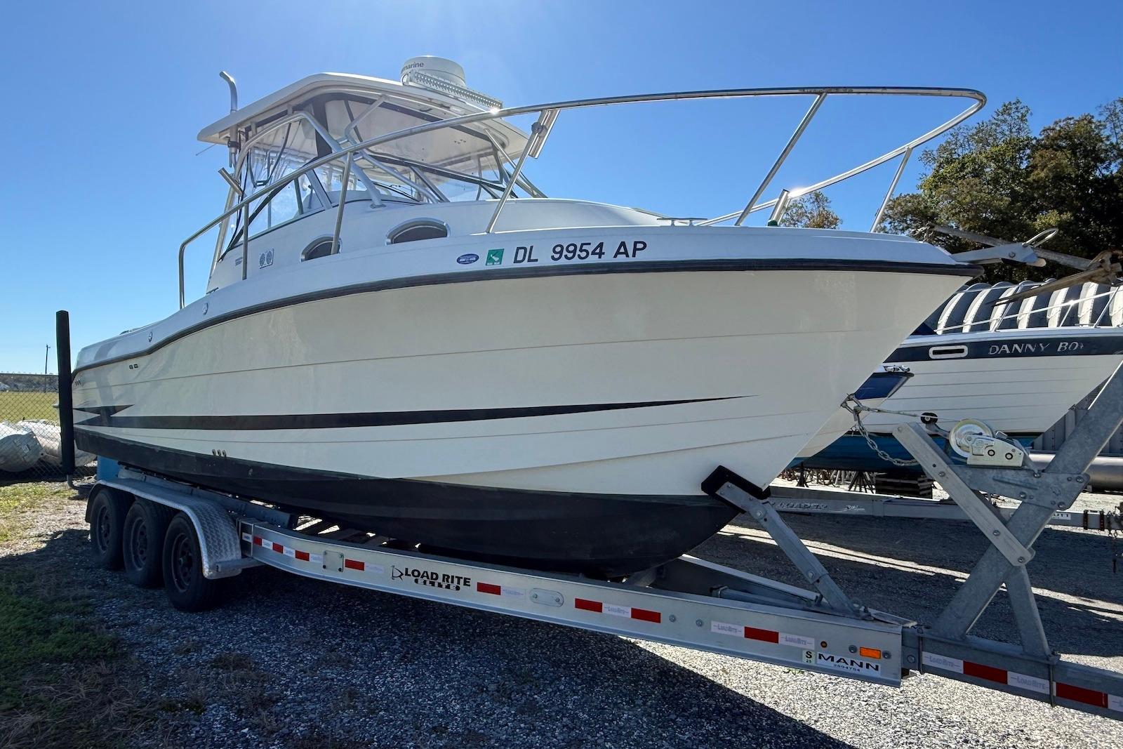 2003 Hydra-Sports Vector 2800 WA boat on trailer, parked outdoors.