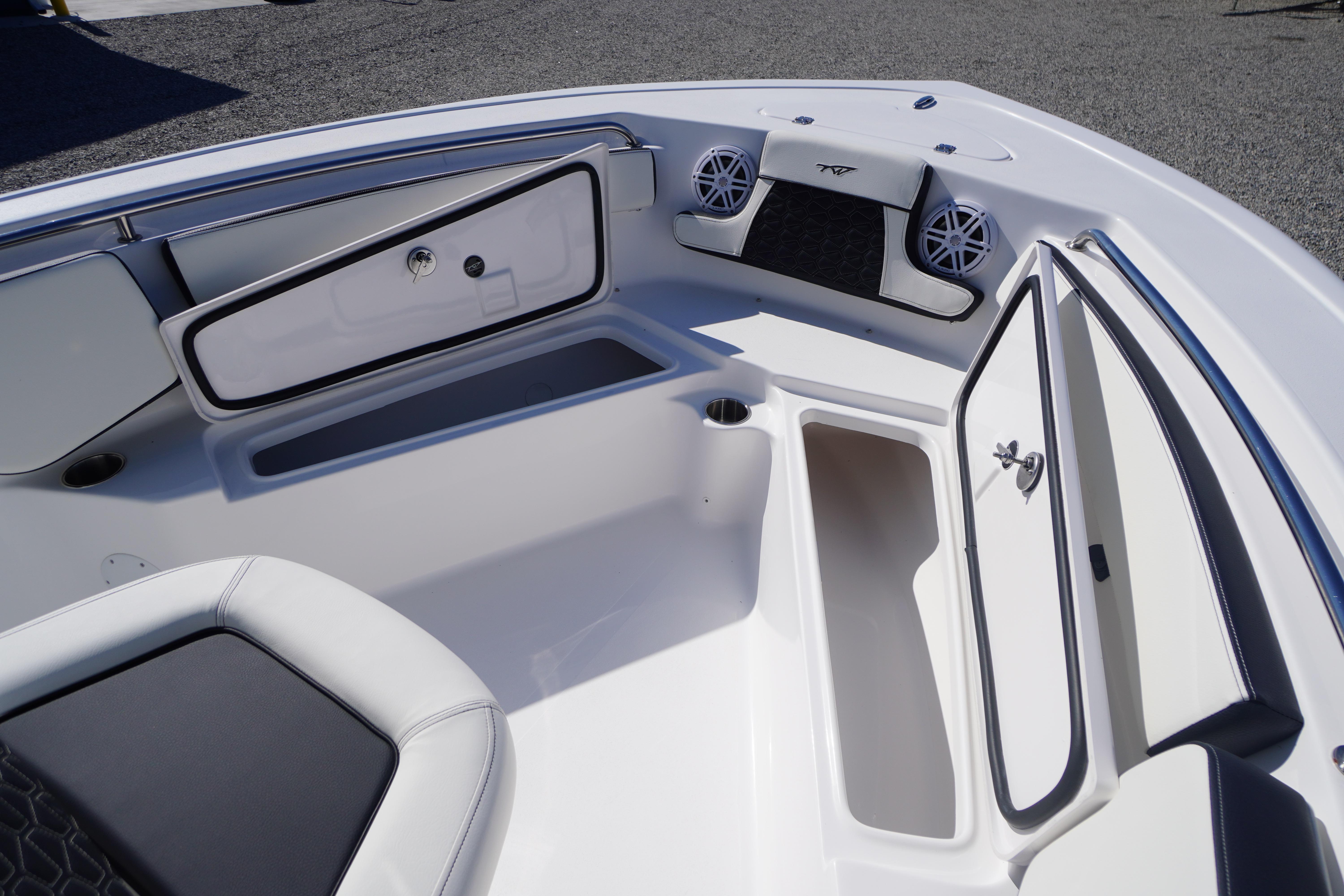 2026 Tidewater 210 CC Adventure boat interior with storage compartments and seating.