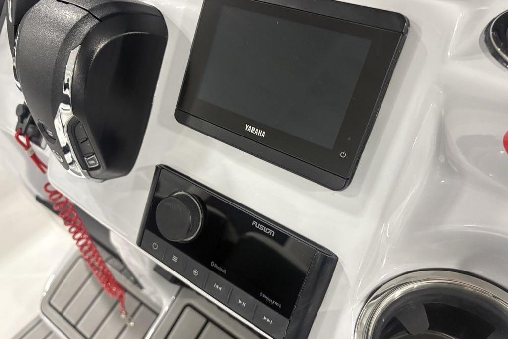 Control panel of 2026 Tidewater 2300 Carolina Bay boat with Yamaha and Fusion displays.