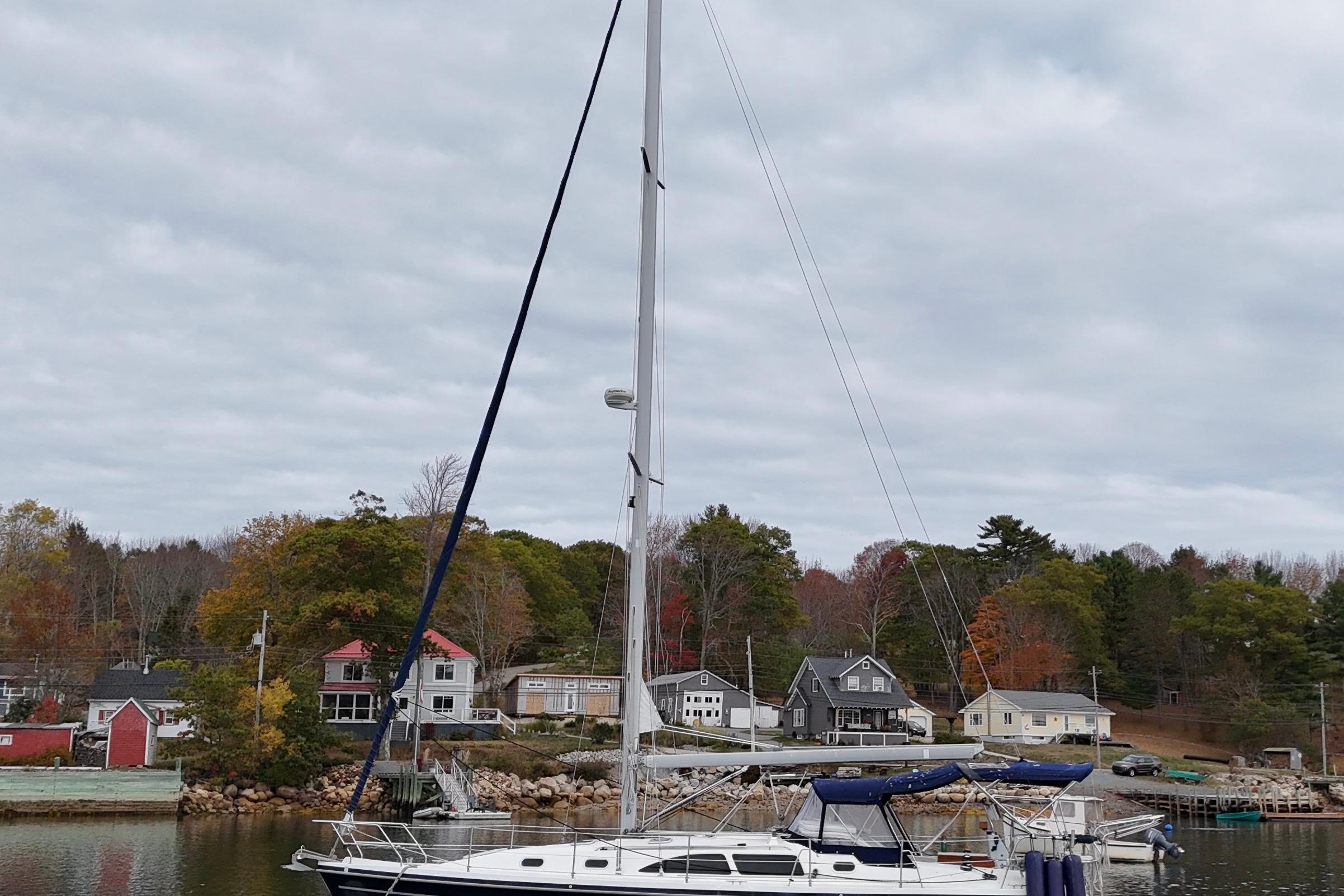 Catalina 387 sailboat docked near scenic waterfront homes, 2003 model.