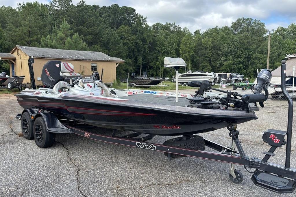 2020 Bass Cat Cougar FTD boat on trailer, parked outdoors with trees in background.