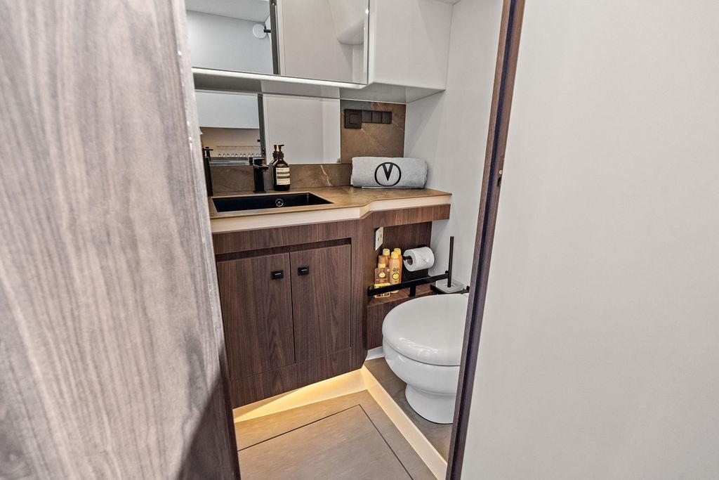 Luxurious bathroom interior of 2024 Vanquish Yachts VQ55, featuring modern fixtures and elegant design.